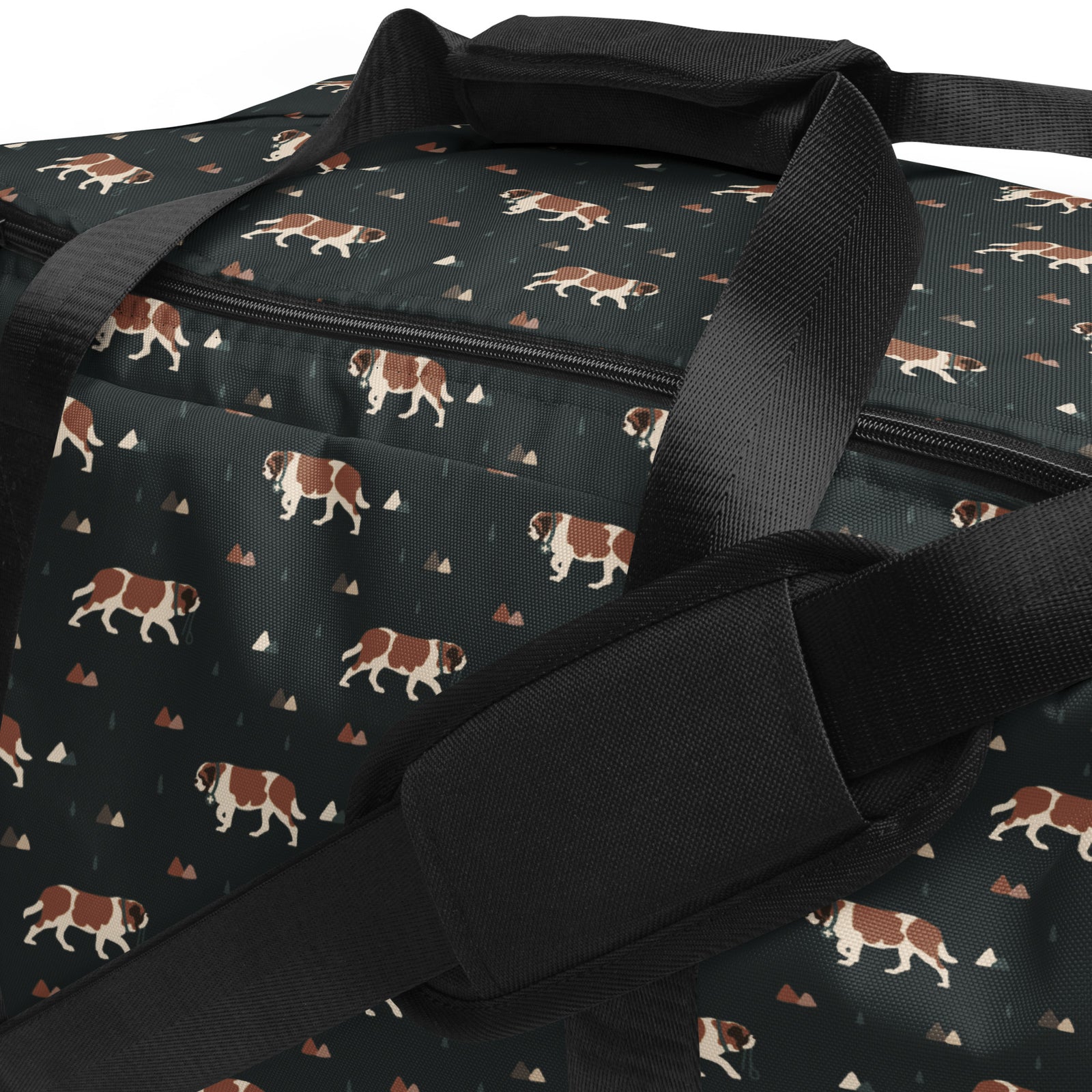 Green Mountain Saint Bernard duffle bag with adjustable padded black shoulder strap, handles, zip compartment, and mesh side pocket on dark green background with mountains, pines and dog pattern.