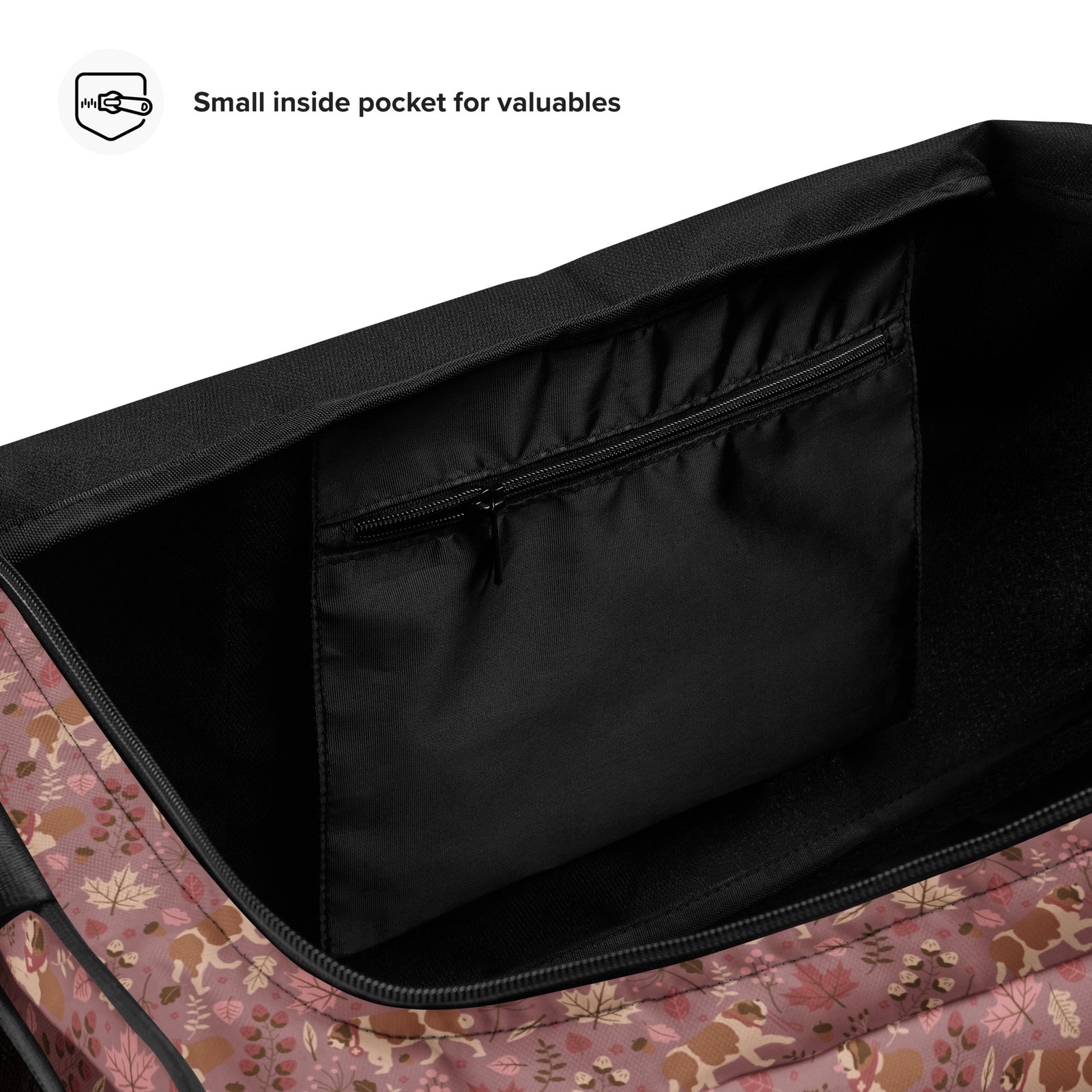 Rosy Fall Saint Bernard floral duffle bag in warm pink, brown, and autumn leaf tones with black padded shoulder strap, handles, zip compartment, and mesh side pocket.