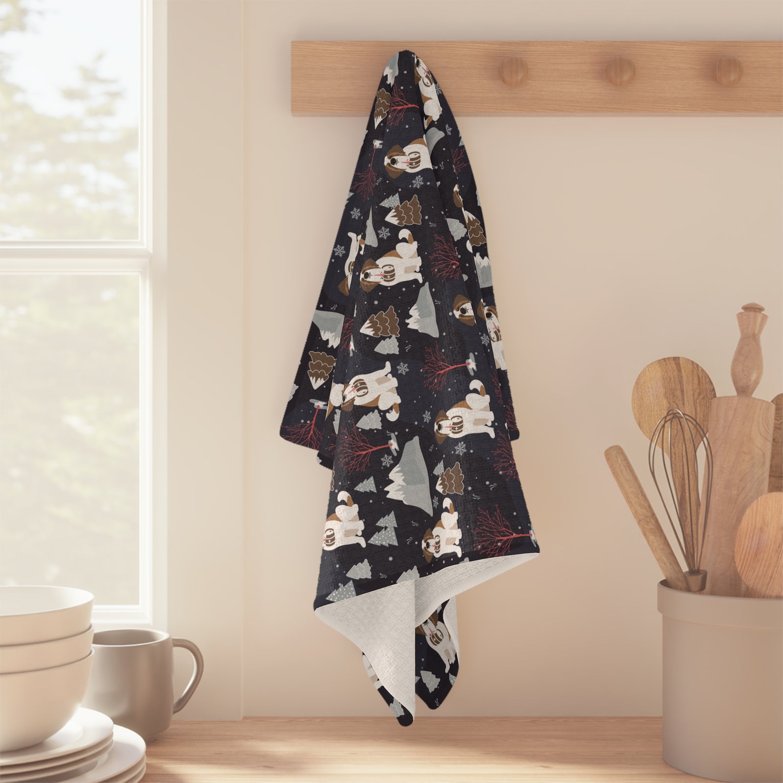 Alpine Night Saint Bernard microfiber tea towel with a navy print of Saint Bernards with rescue barrels among snowy mountains and pines at night.