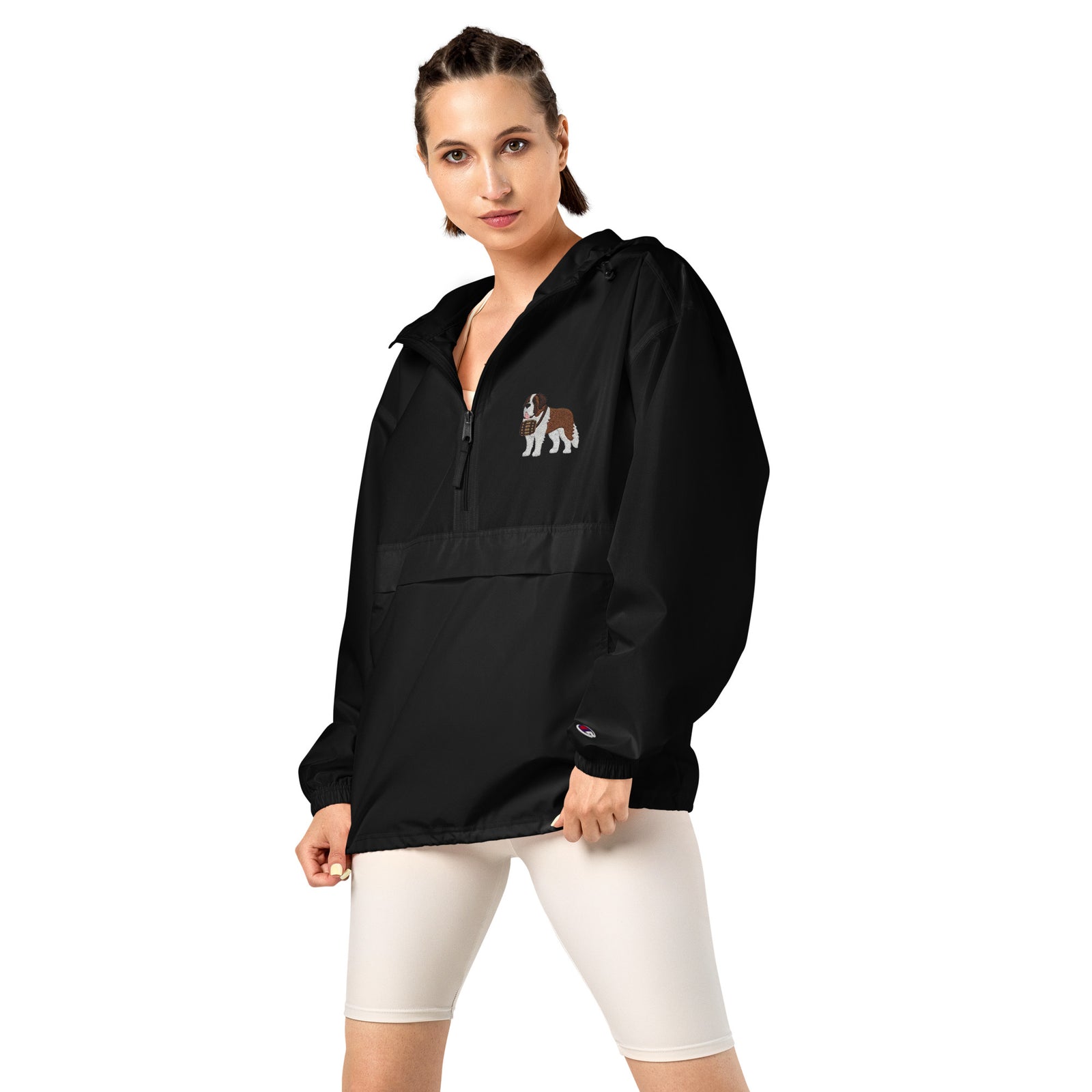 Black Champion packable windbreaker with chest embroidered Saint Bernard and barrel, half zip pullover with hood, kangaroo pocket, and zip pouch.