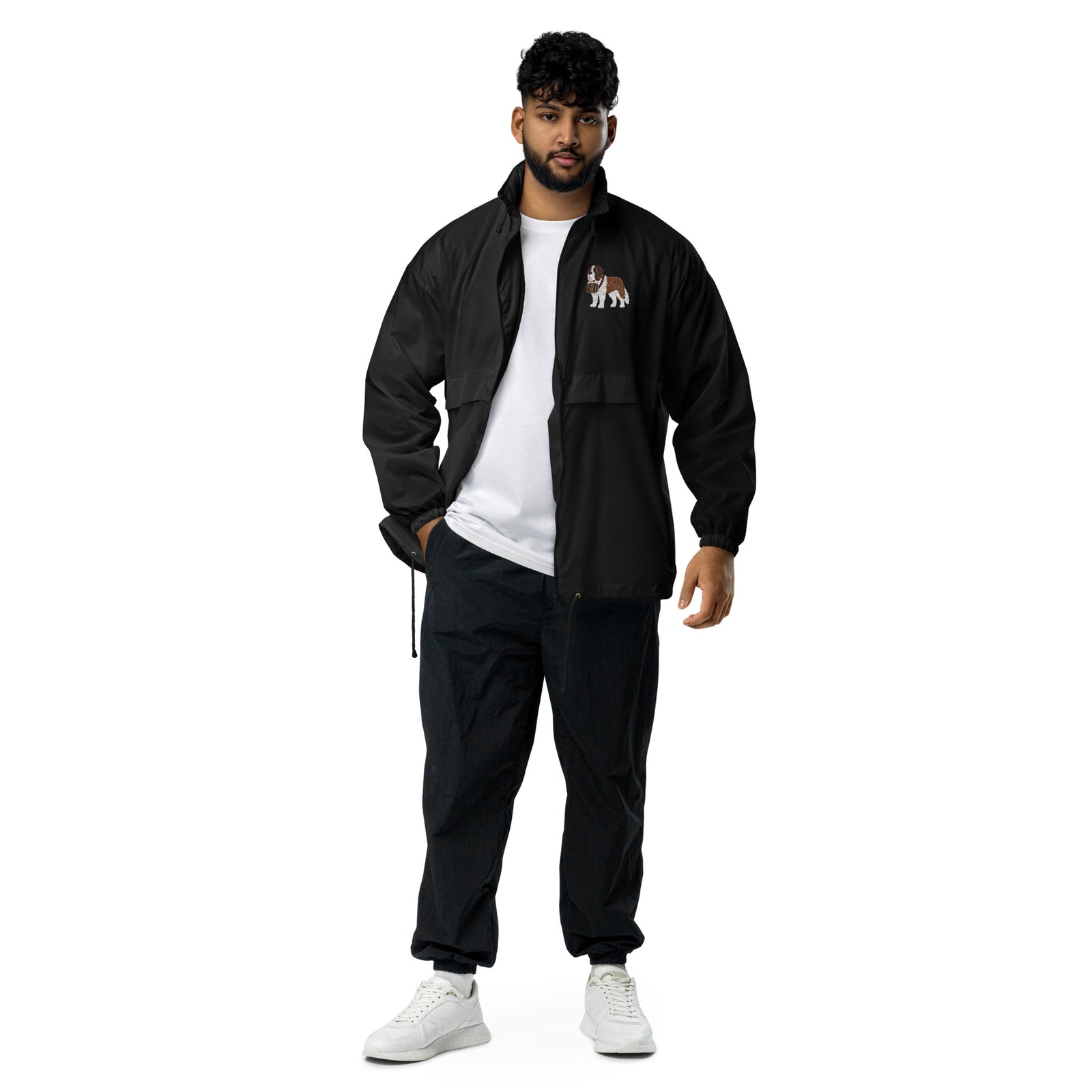 Lightweight, packable black windbreaker with chest embroidered Saint Bernard and barrel, adjustable hood, elastic cuffs, and zip pockets.