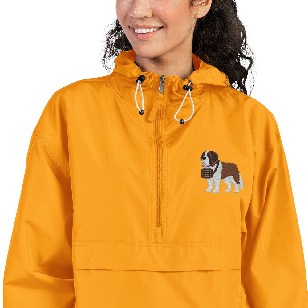 Gold Champion packable windbreaker with chest embroidered Saint Bernard and barrel, half zip pullover with hood, kangaroo pocket, and zip pouch.