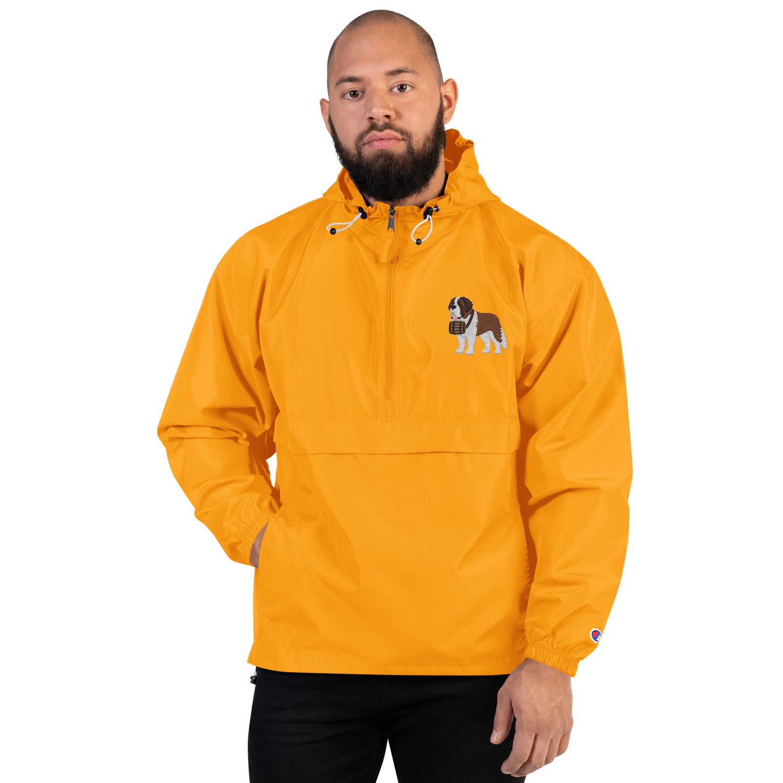Gold Champion packable windbreaker with chest embroidered Saint Bernard and barrel, half zip pullover with hood, kangaroo pocket, and zip pouch.