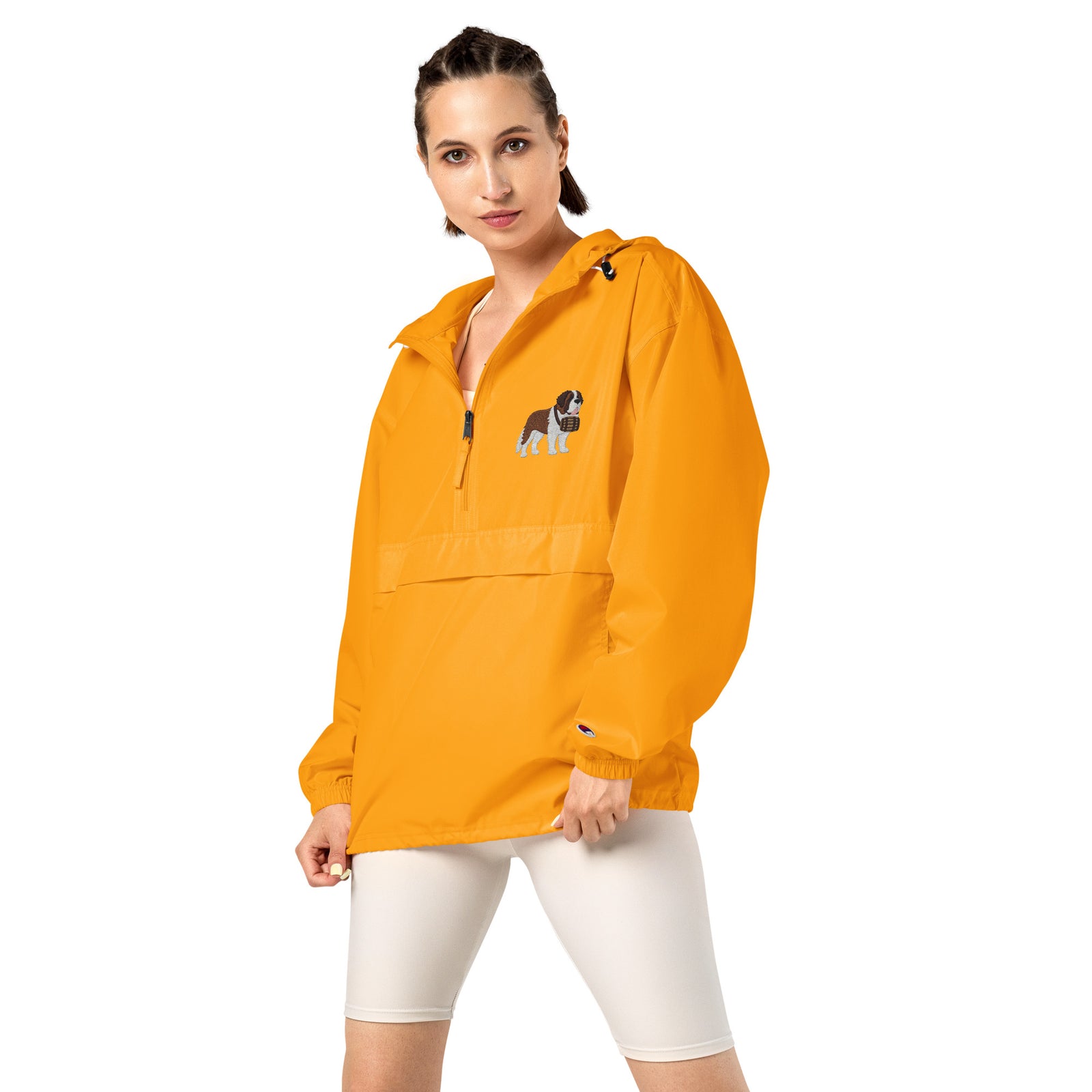 Gold Champion packable windbreaker with chest embroidered Saint Bernard and barrel, half zip pullover with hood, kangaroo pocket, and zip pouch.