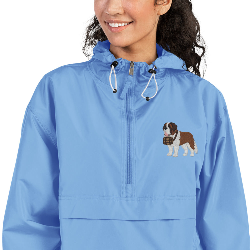 Light blue Champion packable windbreaker with chest embroidered Saint Bernard and barrel, half zip pullover with hood, kangaroo pocket, and zip pouch.
