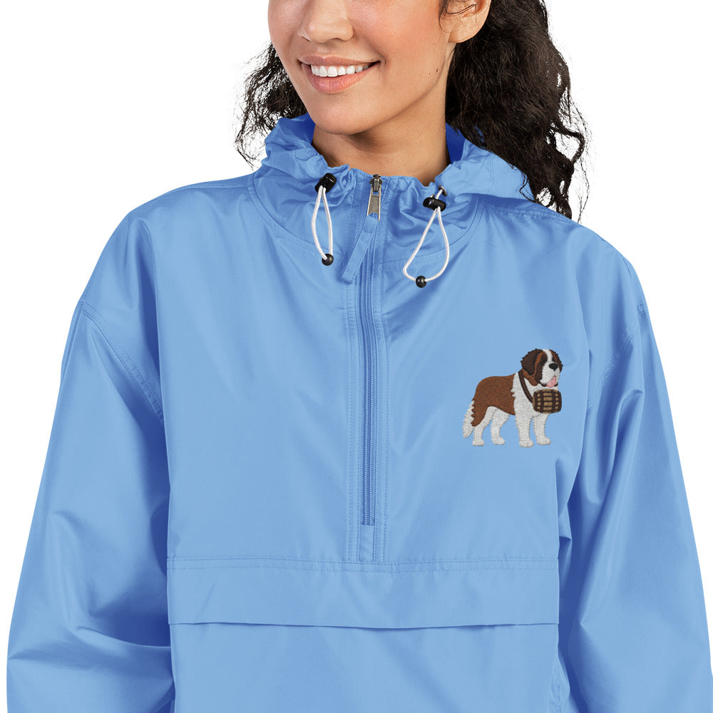 Light blue Champion packable windbreaker with chest embroidered Saint Bernard and barrel, half zip pullover with hood, kangaroo pocket, and zip pouch.