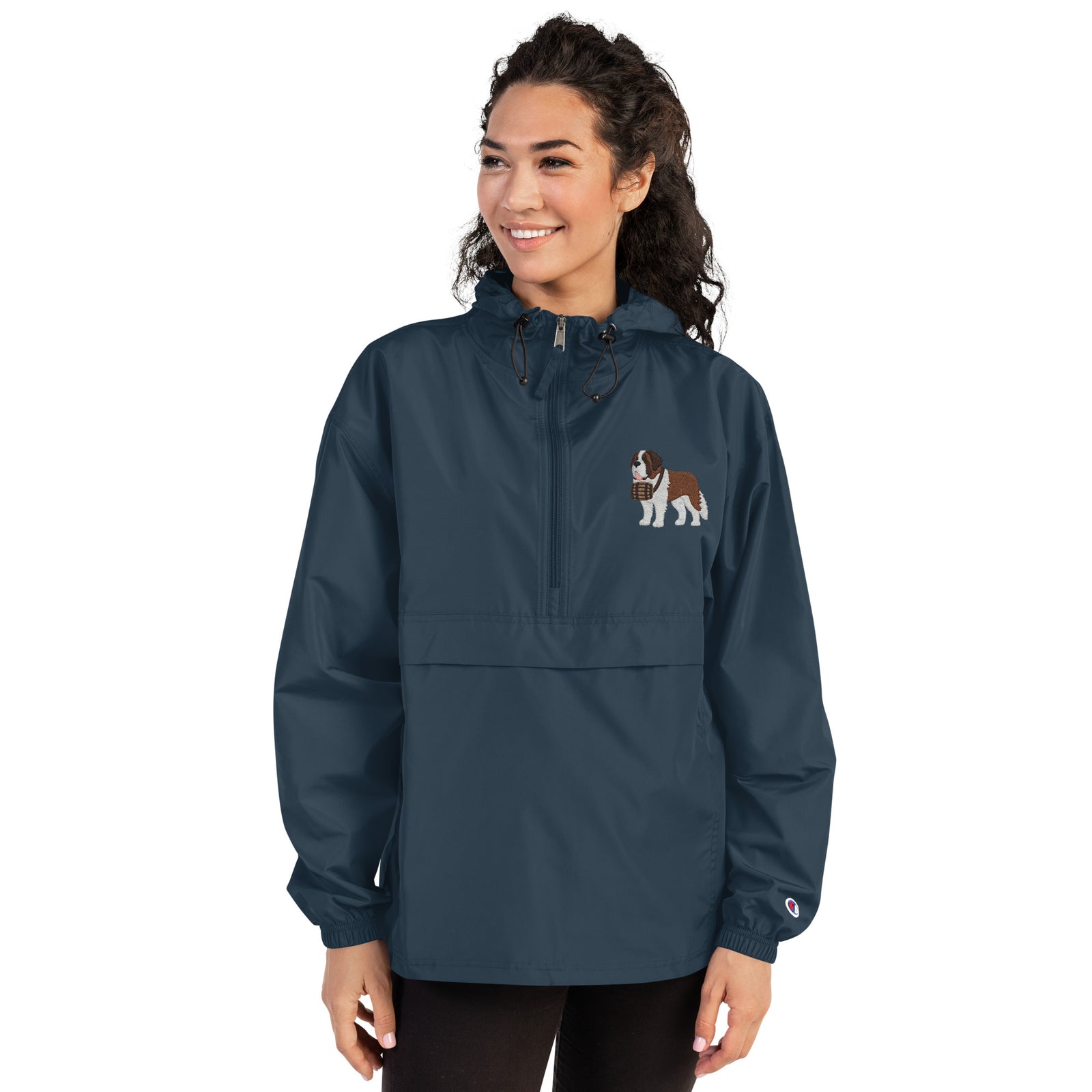 Navy blue Champion packable windbreaker with chest embroidered Saint Bernard and barrel, half zip pullover with hood, kangaroo pocket, and zip pouch.