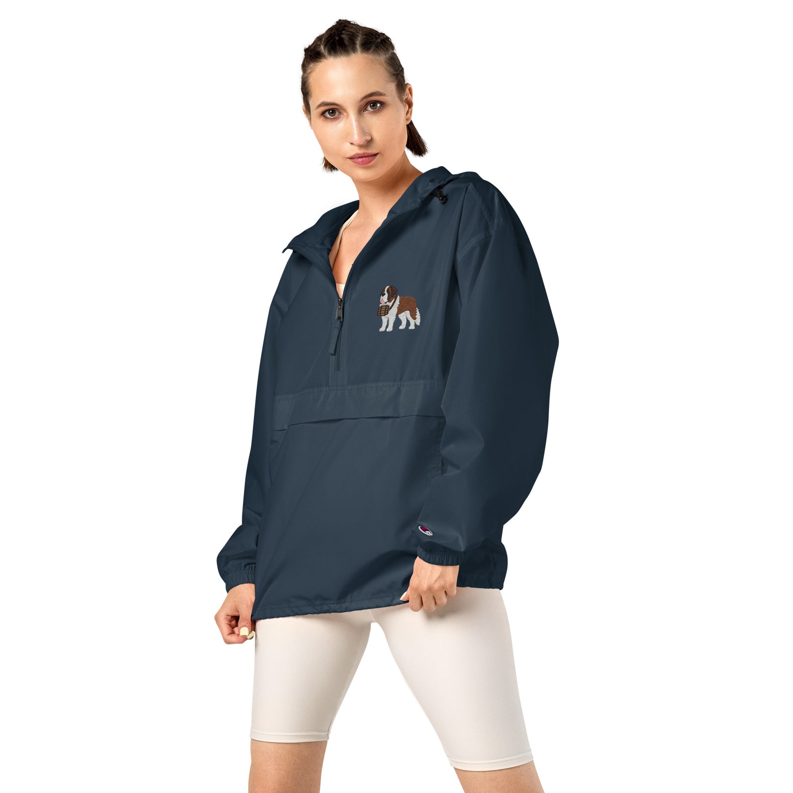 Navy blue Champion packable windbreaker with chest embroidered Saint Bernard and barrel, half zip pullover with hood, kangaroo pocket, and zip pouch.