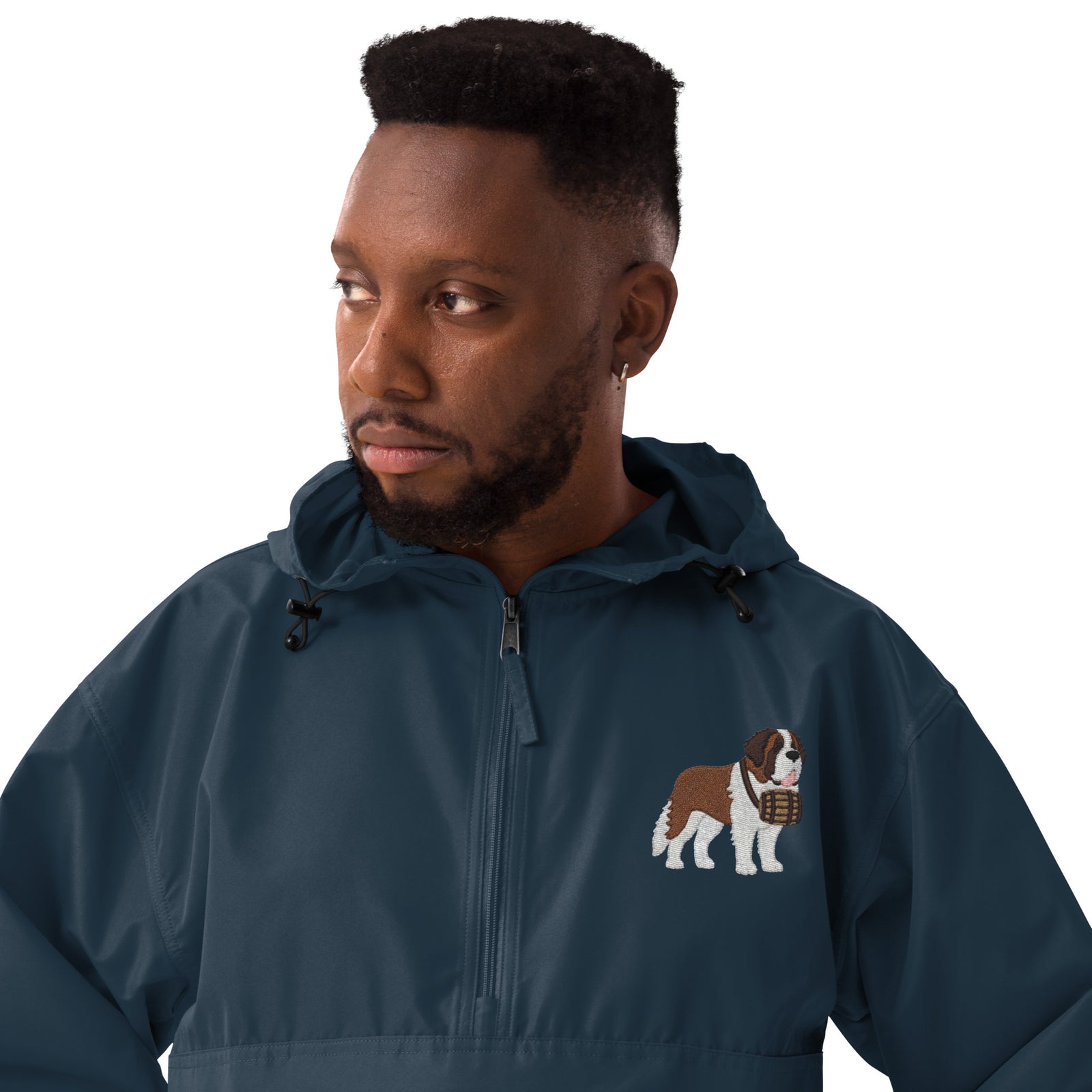 Navy blue Champion packable windbreaker with chest embroidered Saint Bernard and barrel, half zip pullover with hood, kangaroo pocket, and zip pouch.