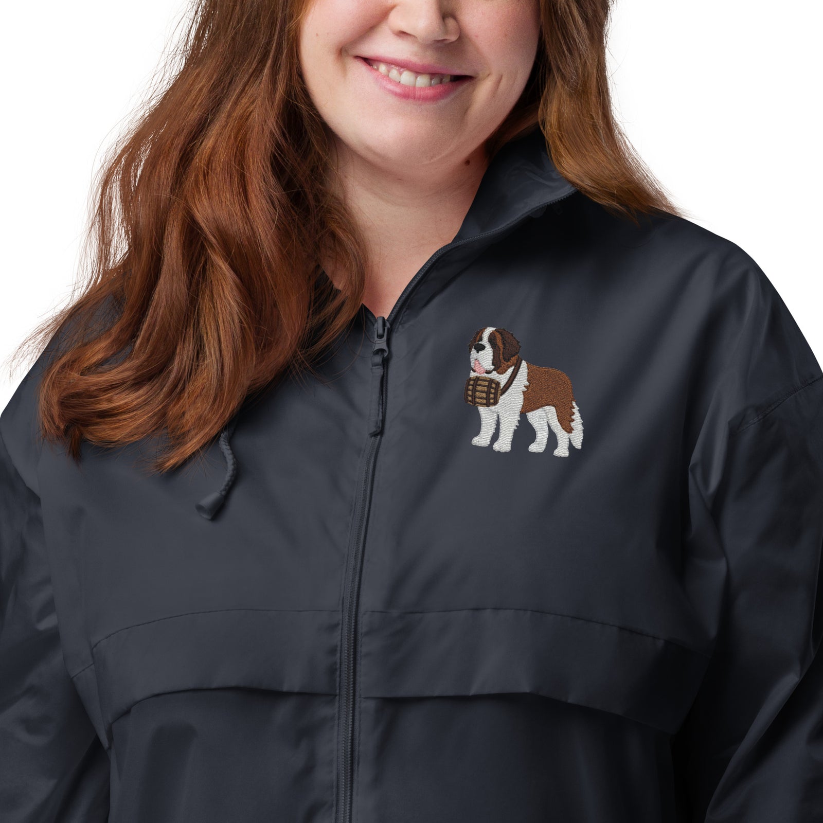 Lightweight, packable navy blue windbreaker with chest embroidered Saint Bernard and barrel, adjustable hood, elastic cuffs, and zip pockets.
