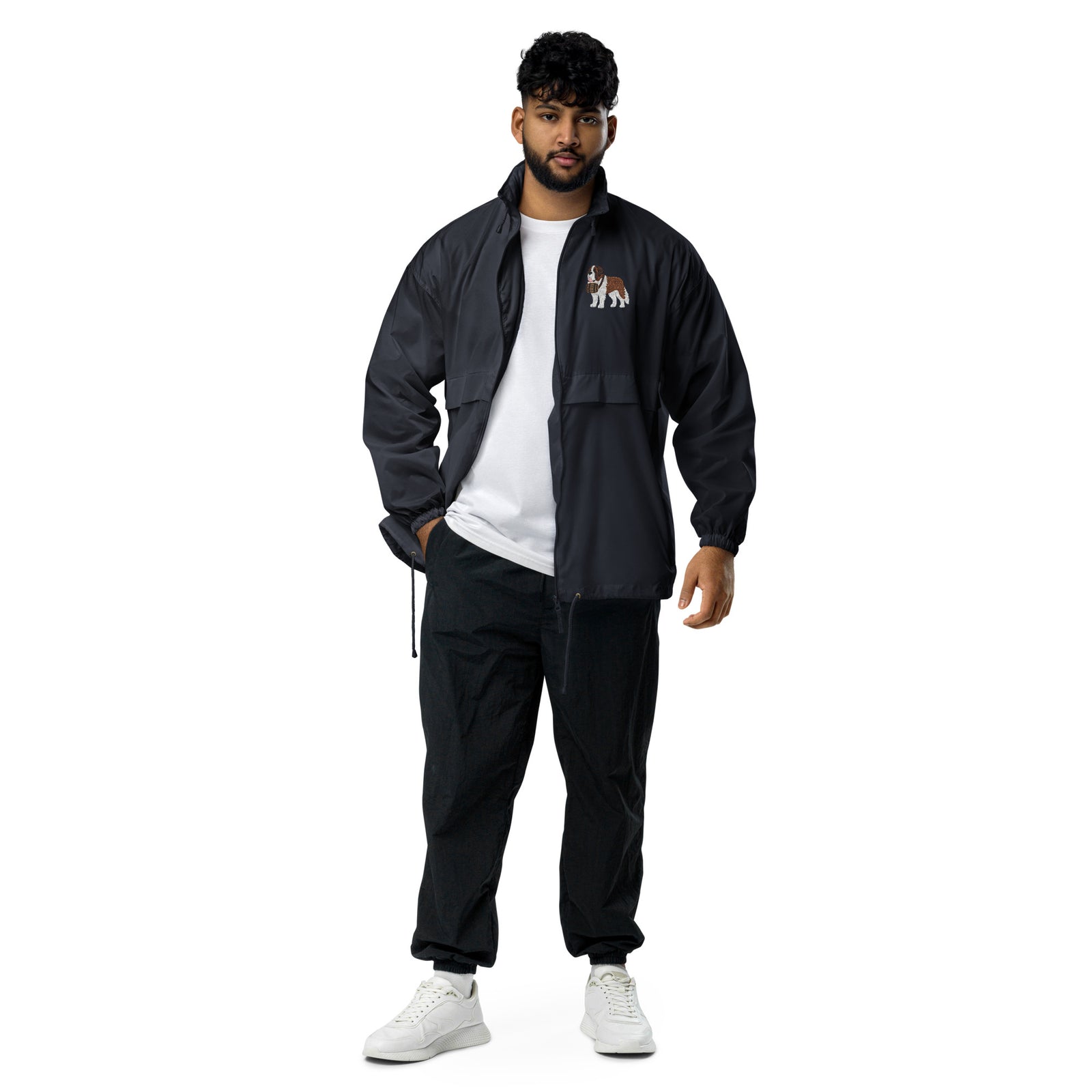 Lightweight, packable navy blue windbreaker with chest embroidered Saint Bernard and barrel, adjustable hood, elastic cuffs, and zip pockets.
