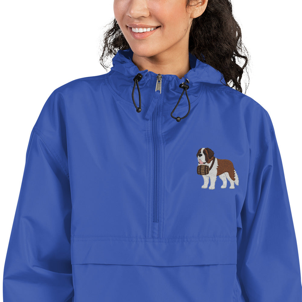 Royal blue Champion packable windbreaker with chest embroidered Saint Bernard and barrel, half zip pullover with hood, kangaroo pocket, and zip pouch.