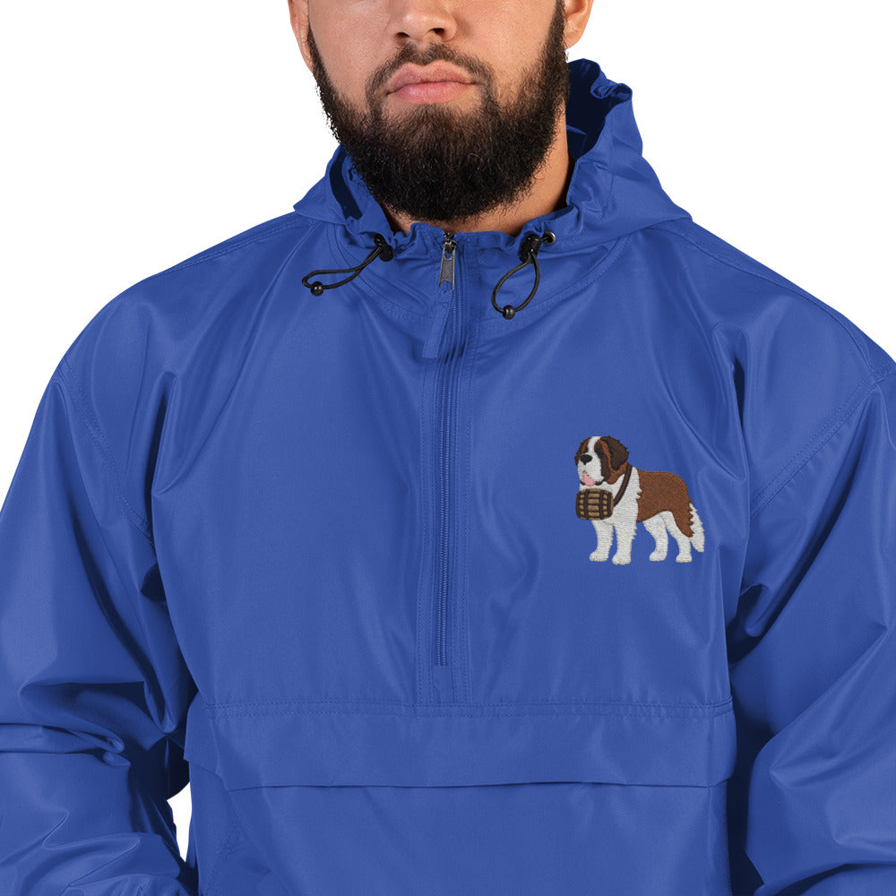 Royal blue Champion packable windbreaker with chest embroidered Saint Bernard and barrel, half zip pullover with hood, kangaroo pocket, and zip pouch.