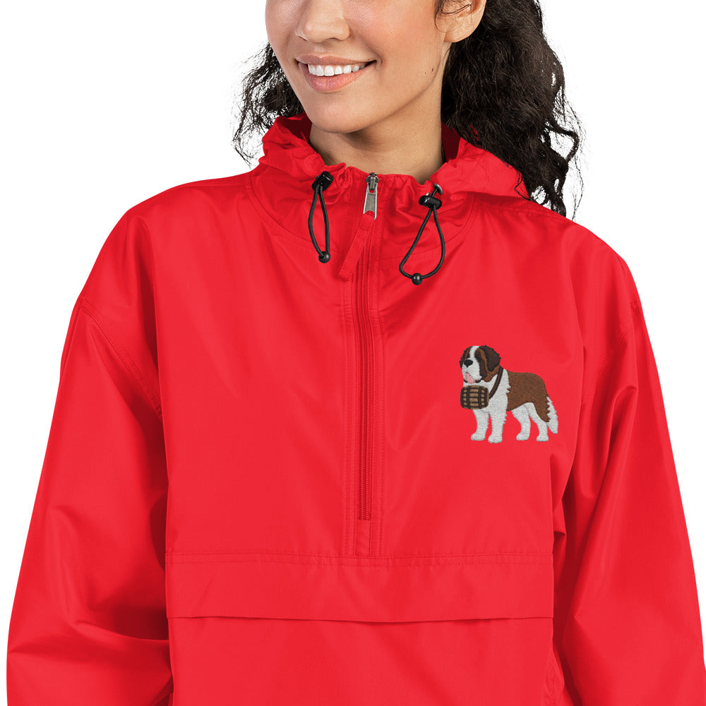 Red Champion packable windbreaker with chest embroidered Saint Bernard and barrel, half zip pullover with hood, kangaroo pocket, and zip pouch.