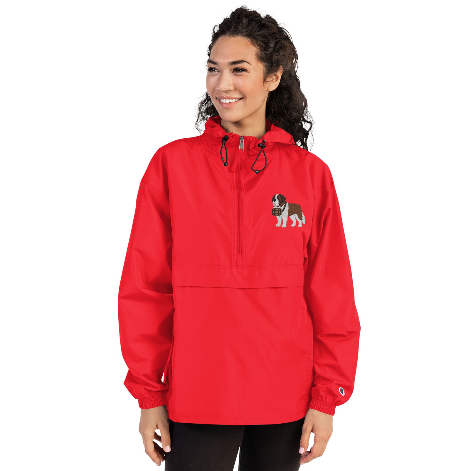 Red Champion packable windbreaker with chest embroidered Saint Bernard and barrel, half zip pullover with hood, kangaroo pocket, and zip pouch.