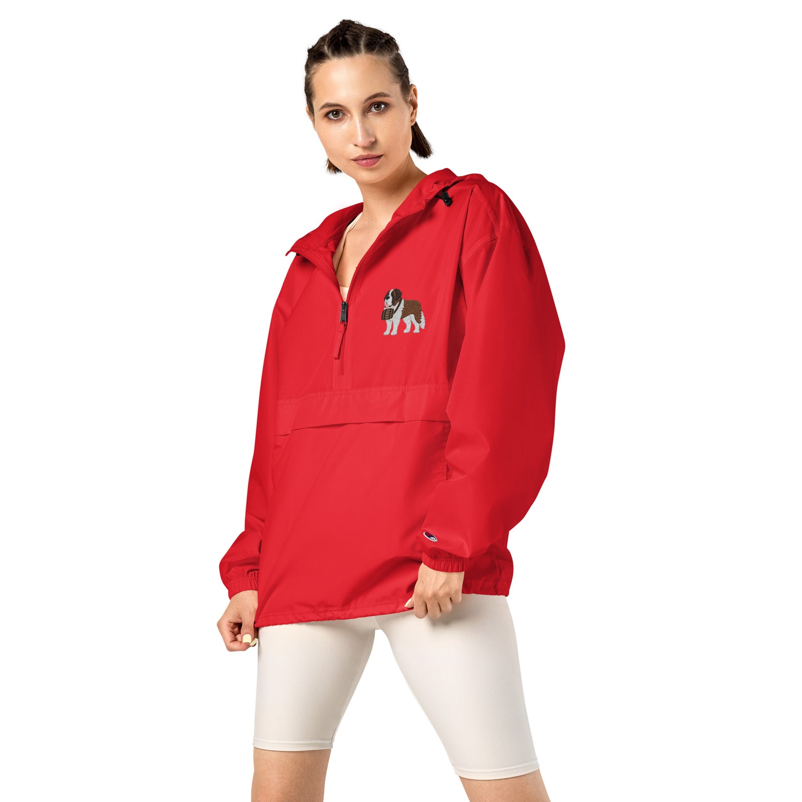 Red Champion packable windbreaker with chest embroidered Saint Bernard and barrel, half zip pullover with hood, kangaroo pocket, and zip pouch.