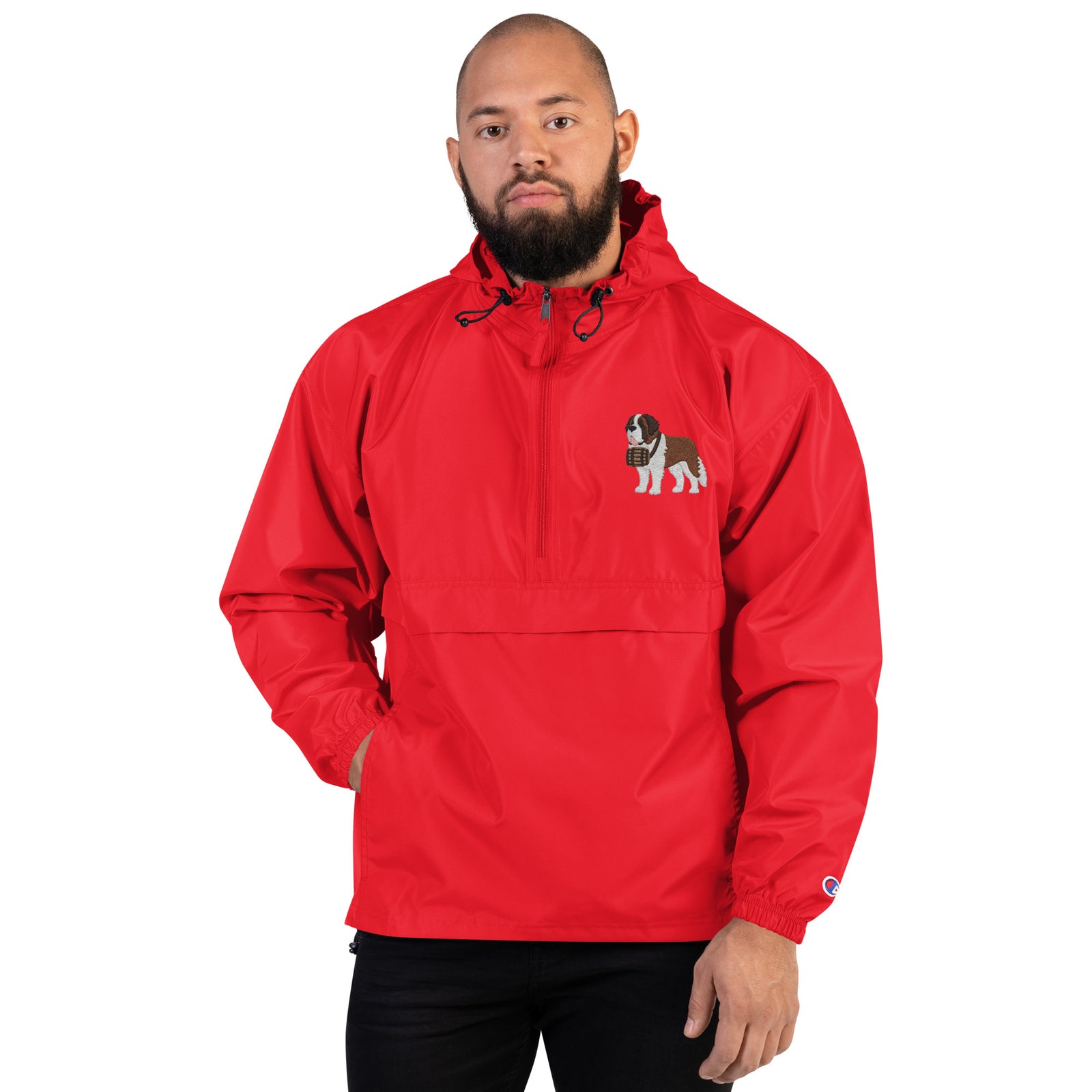 Red Champion packable windbreaker with chest embroidered Saint Bernard and barrel, half zip pullover with hood, kangaroo pocket, and zip pouch.