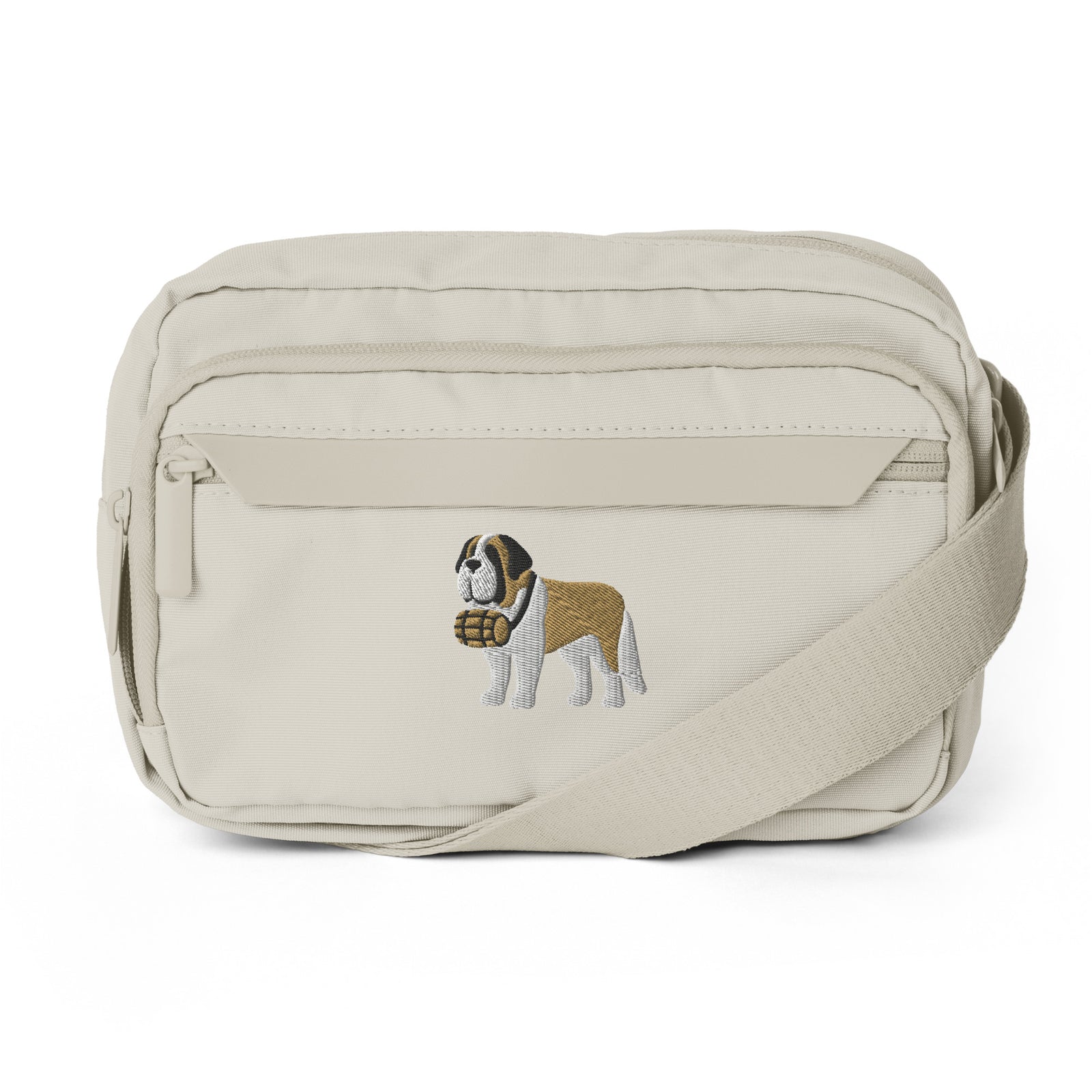 Natural stone colored Saint Bernard crossbody bag with an embroidered Saint Bernard and rescue barrel, adjustable strap, and zip pockets.