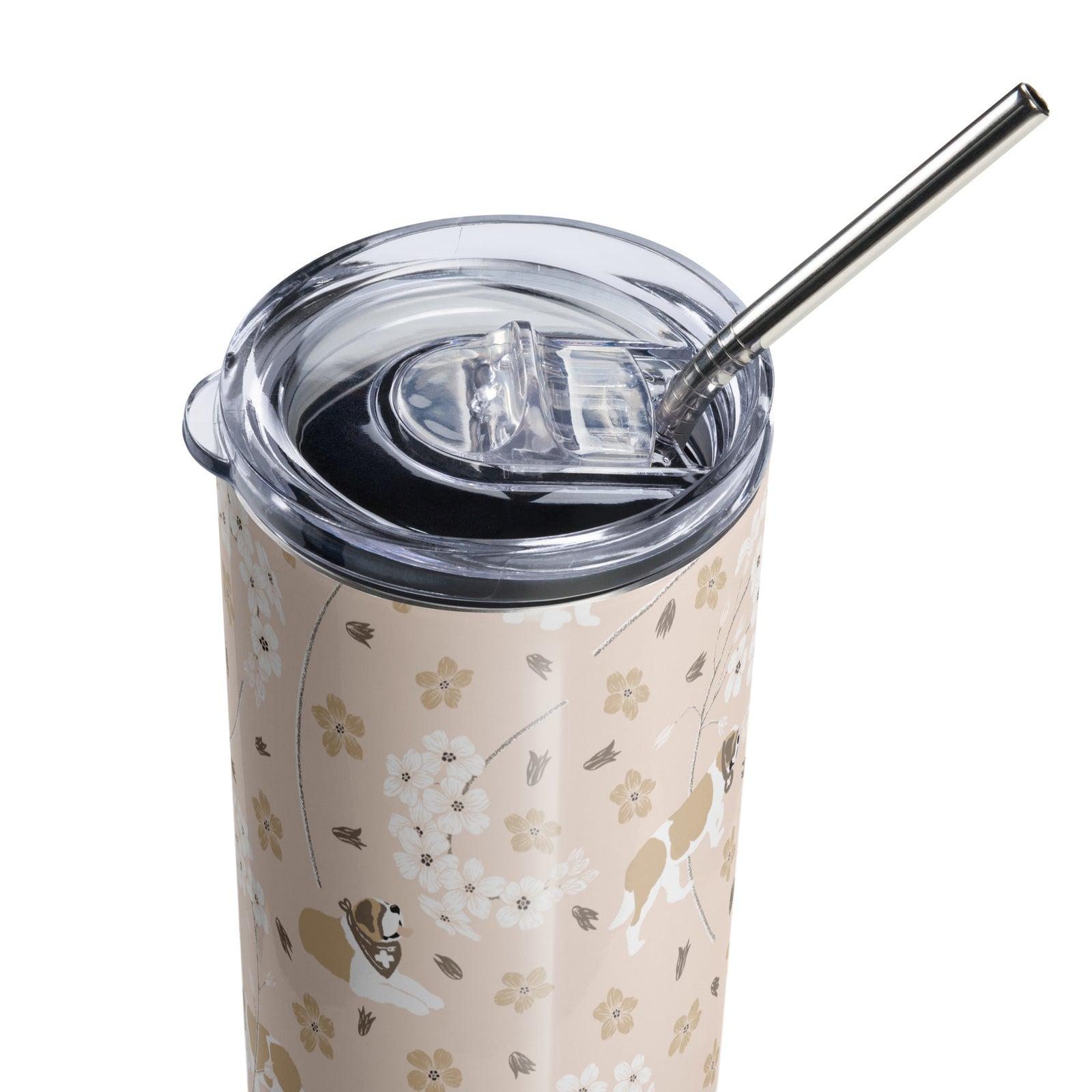 Stainless steel Forget Me Not Saint Bernard skinny tumbler with a blush finish featuring Saint Bernards among delicate white and golden florals, with a lid and metal straw.