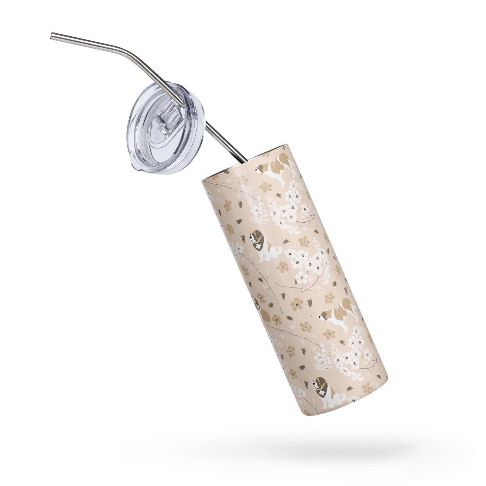 Stainless steel Forget Me Not Saint Bernard skinny tumbler with a blush finish featuring Saint Bernards among delicate white and golden florals, with a lid and metal straw.