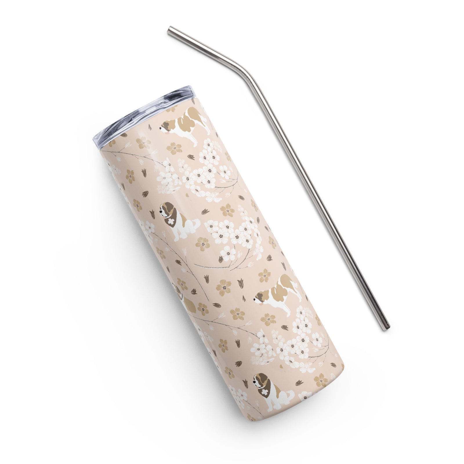 Stainless steel Forget Me Not Saint Bernard skinny tumbler with a blush finish featuring Saint Bernards among delicate white and golden florals, with a lid and metal straw.