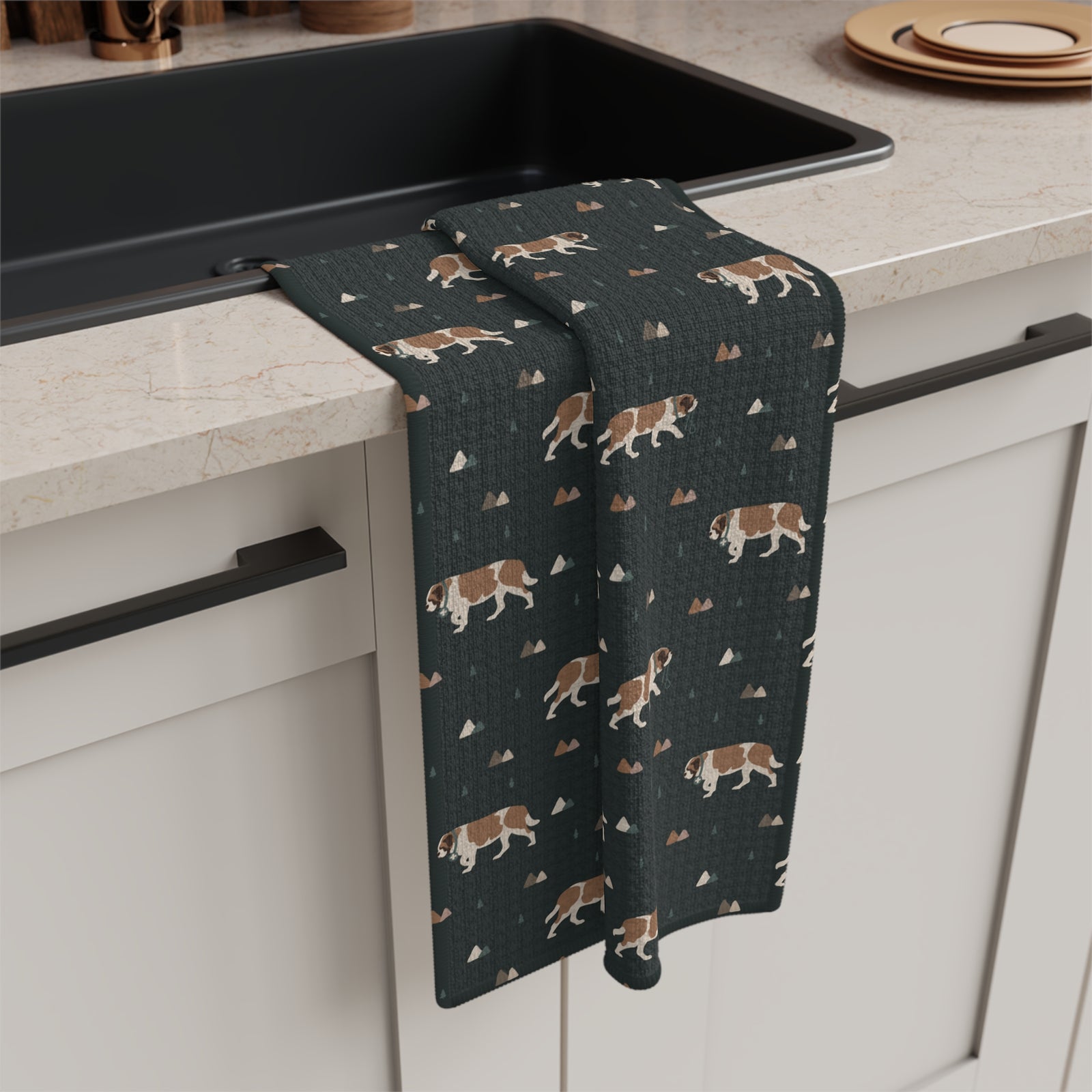 Green Mountain Saint Bernard microfiber tea towel with a forest-green print of Saint Bernards walking among mountains and pine trees.