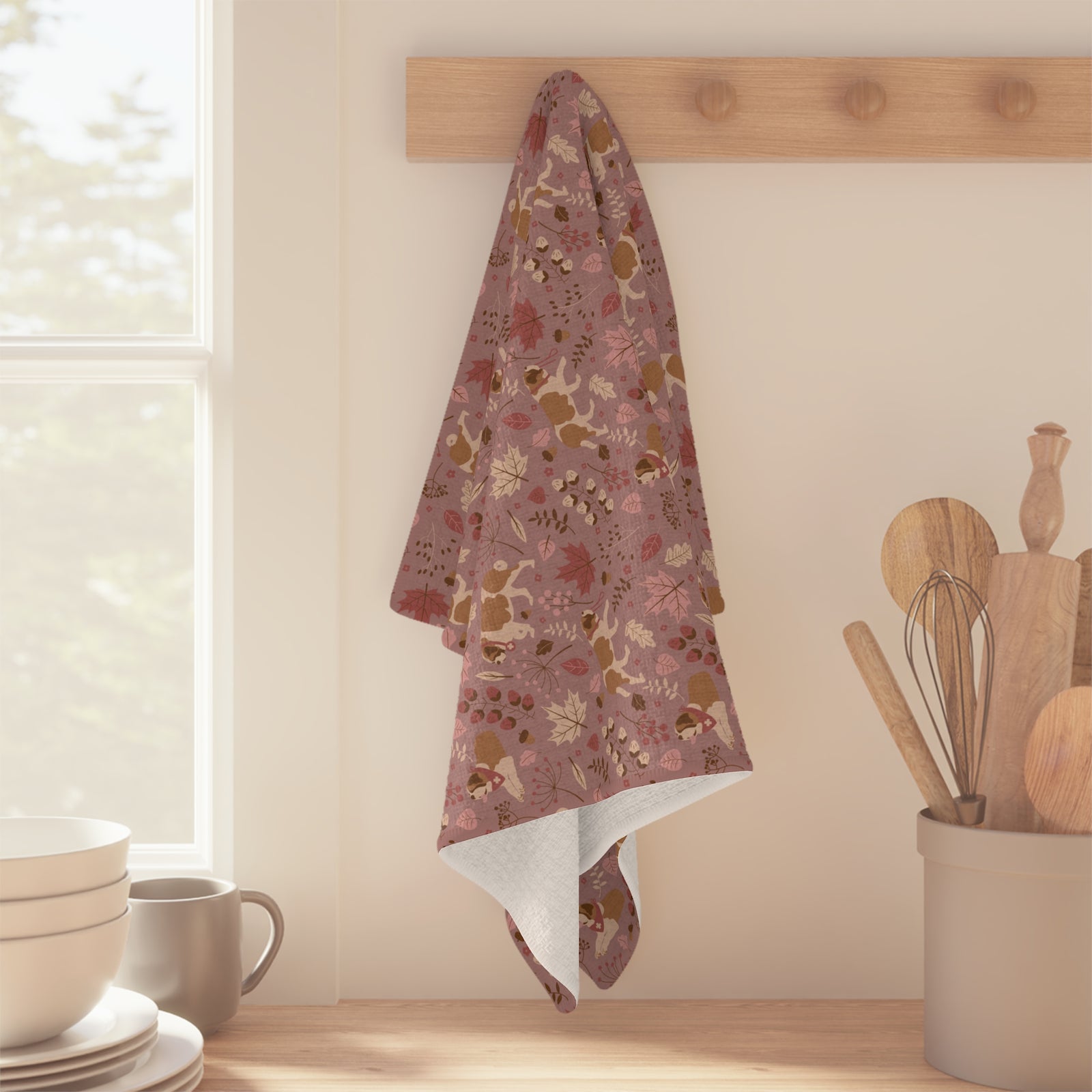 Rosy Fall Saint Bernard microfiber tea towel with a dusty-rose print of Saint Bernards among maple leaves, acorns, and autumn berries.
