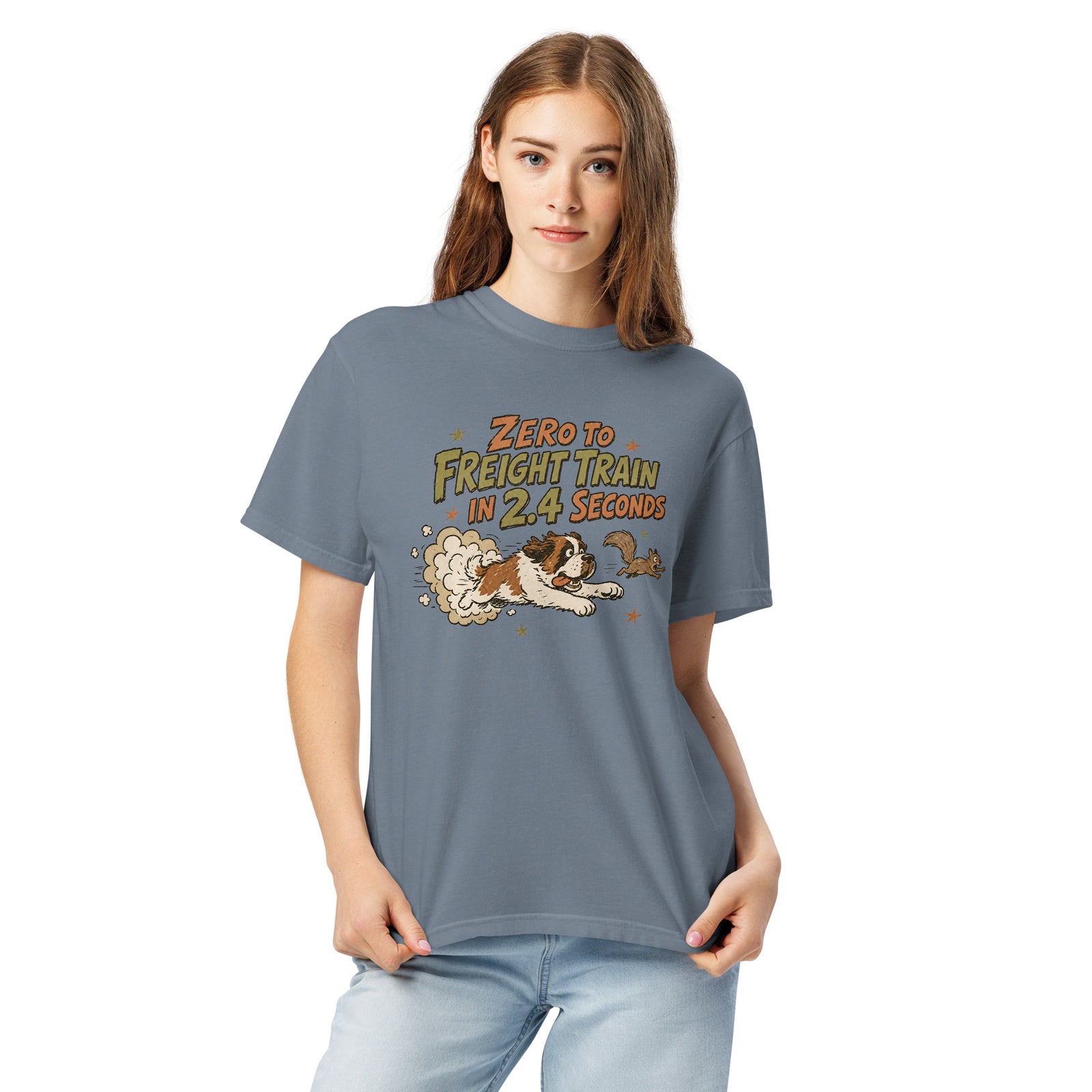 Blue jean Comfort Colors t-shirt with a retro earth tone cartoon of a funny Saint Bernard chasing a squirrel and Zero to Freight Train in 2.4 Seconds lettering.