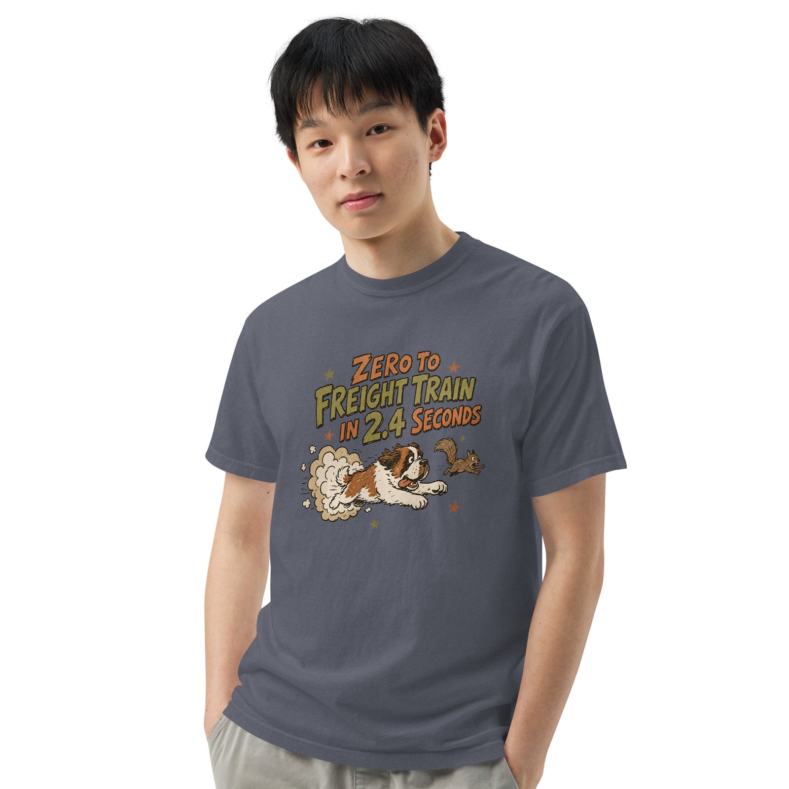 Denim blue Comfort Colors t-shirt with a retro earth tone cartoon of a funny Saint Bernard chasing a squirrel and Zero to Freight Train in 2.4 Seconds lettering.