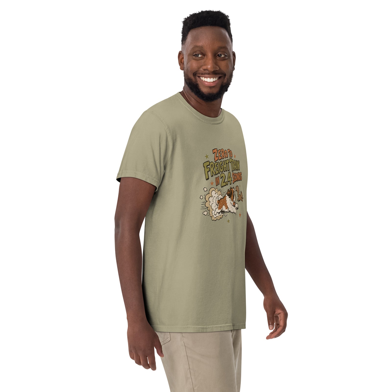 Khaki Comfort Colors t-shirt with a retro earth tone cartoon of a funny Saint Bernard chasing a squirrel and Zero to Freight Train in 2.4 Seconds lettering.