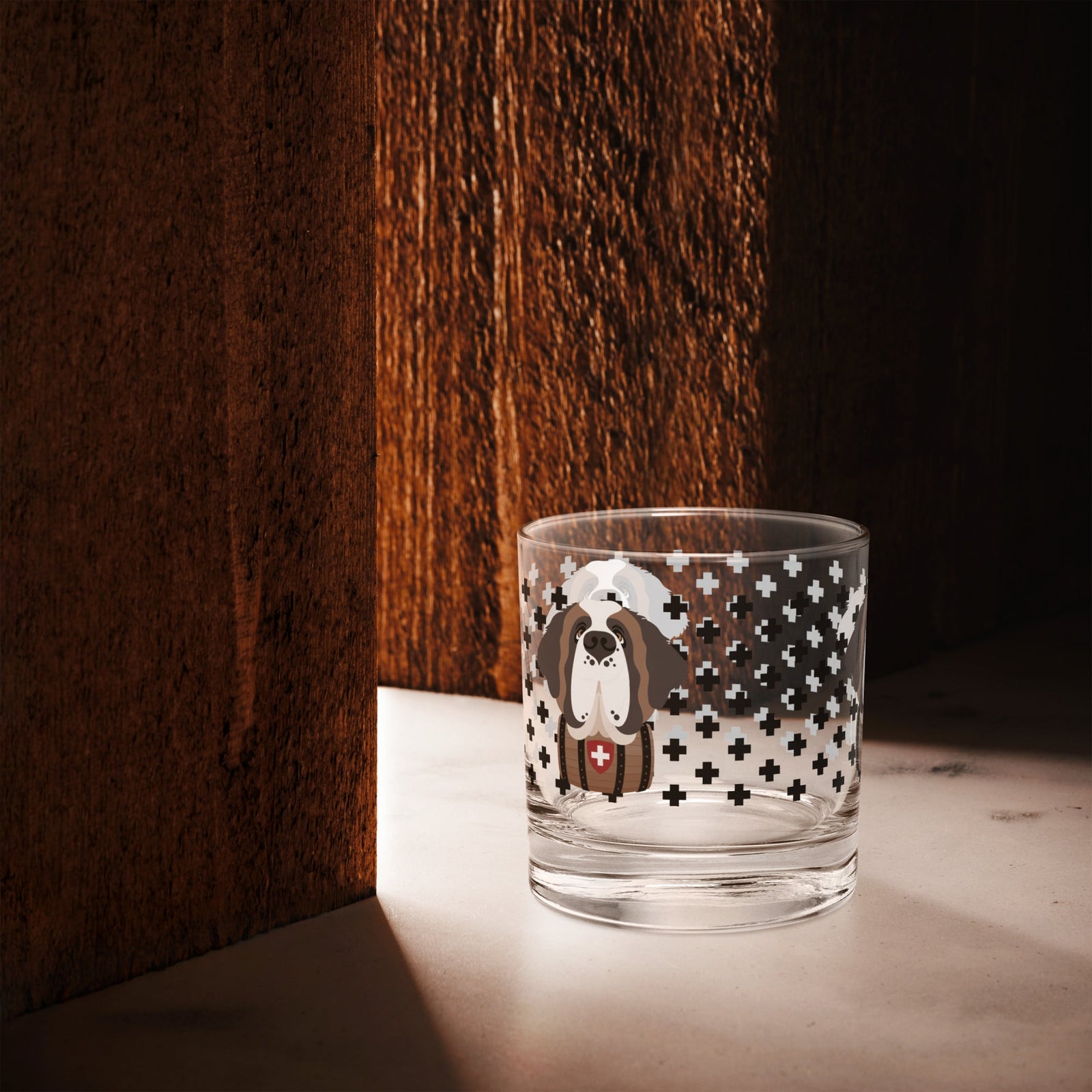 10.5 once rock glass drinkware with a modern pattern of Swiss inspired black crosses and a cute large Saint Bernard dog head with a barrel by Lucy and Norman