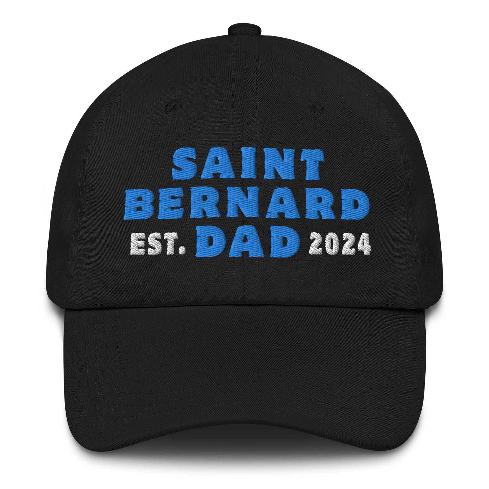 A black baseball cap with the text 'SAINT BERNARD EST. DAD 2024' embroidered in blue.