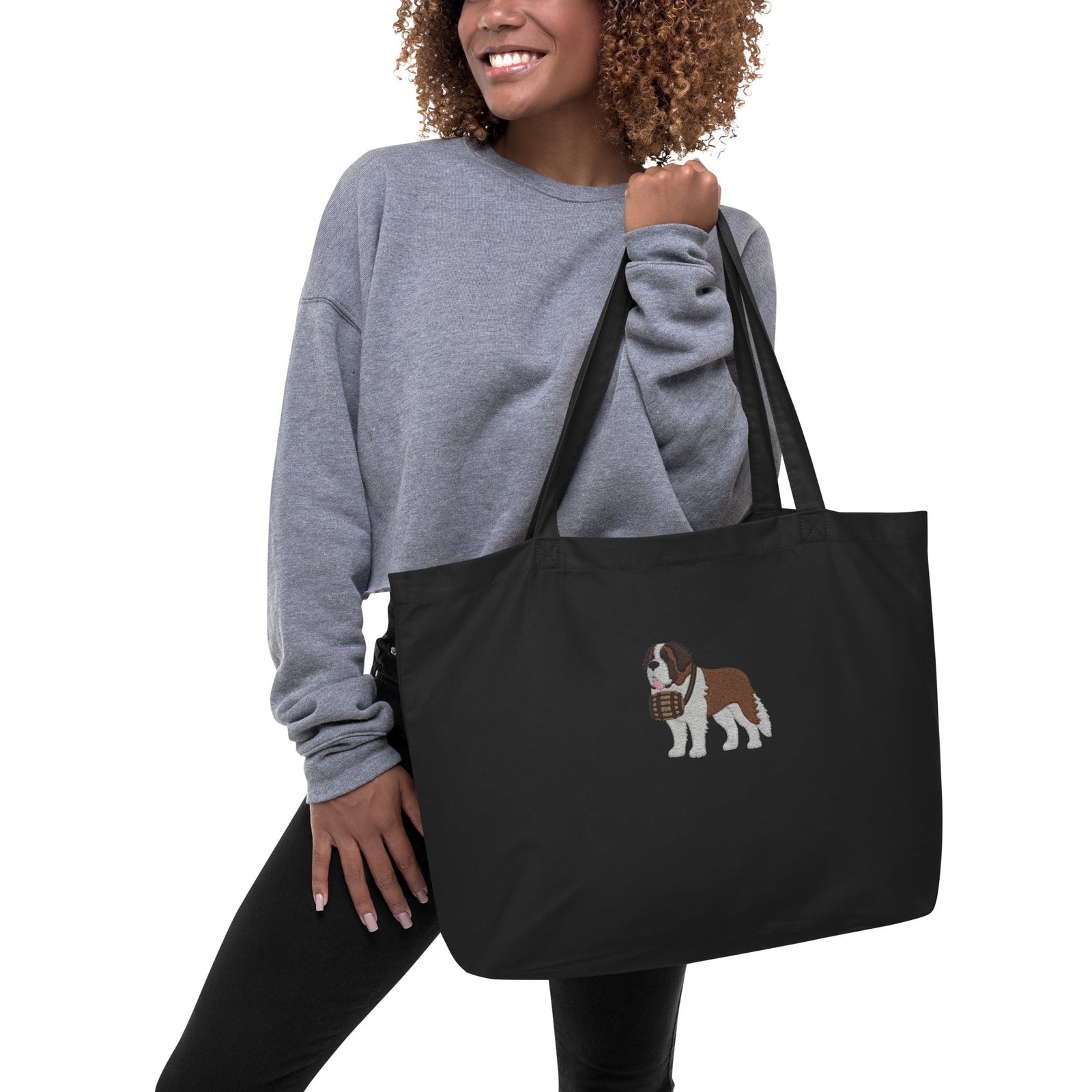 Large black organic tote bag embroidered with a detailed Saint Bernard with a barrel around its neck by Lucy and Norman.
