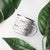 Lightweight 12 oz enamel camp mug. Features a modern pattern of Saint Bernard dogs, mountains and pine trees on a white background by Lucy and Norman
