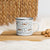 Lightweight 12 oz enamel camp mug. Features a modern pattern of Saint Bernard dogs, mountains and pine trees on a white background by Lucy and Norman