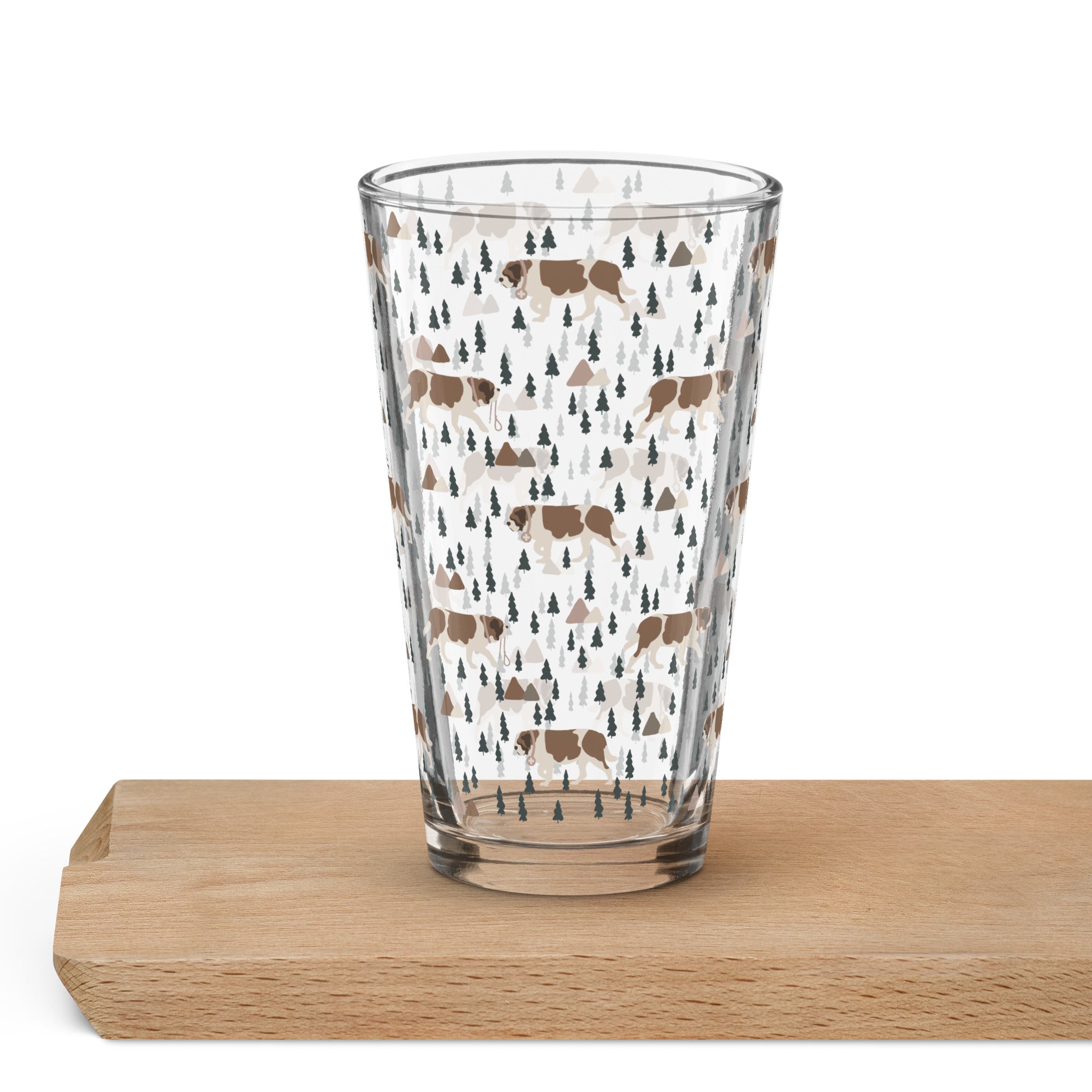 16 oz shaker pint glass with a modern pattern of Saint Bernard dogs, mountains and pine trees by Lucy and Norman