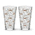 16 oz shaker pint glass with a modern pattern of Saint Bernard dogs, mountains and pine trees by Lucy and Norman