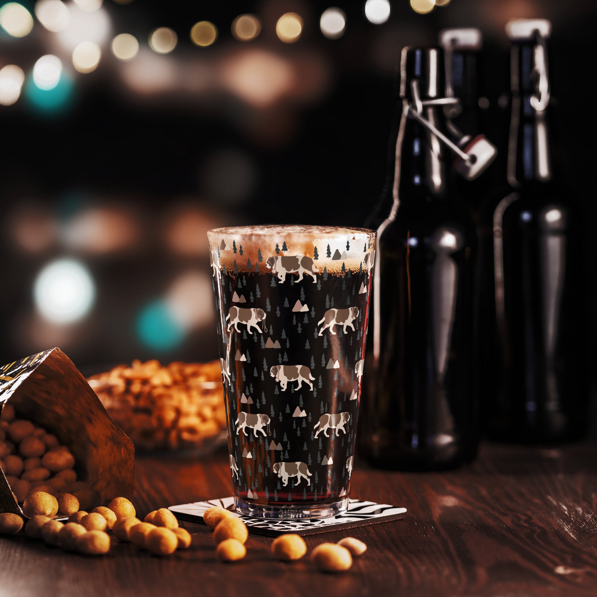16 oz shaker pint glass with a modern pattern of Saint Bernard dogs, mountains and pine trees by Lucy and Norman