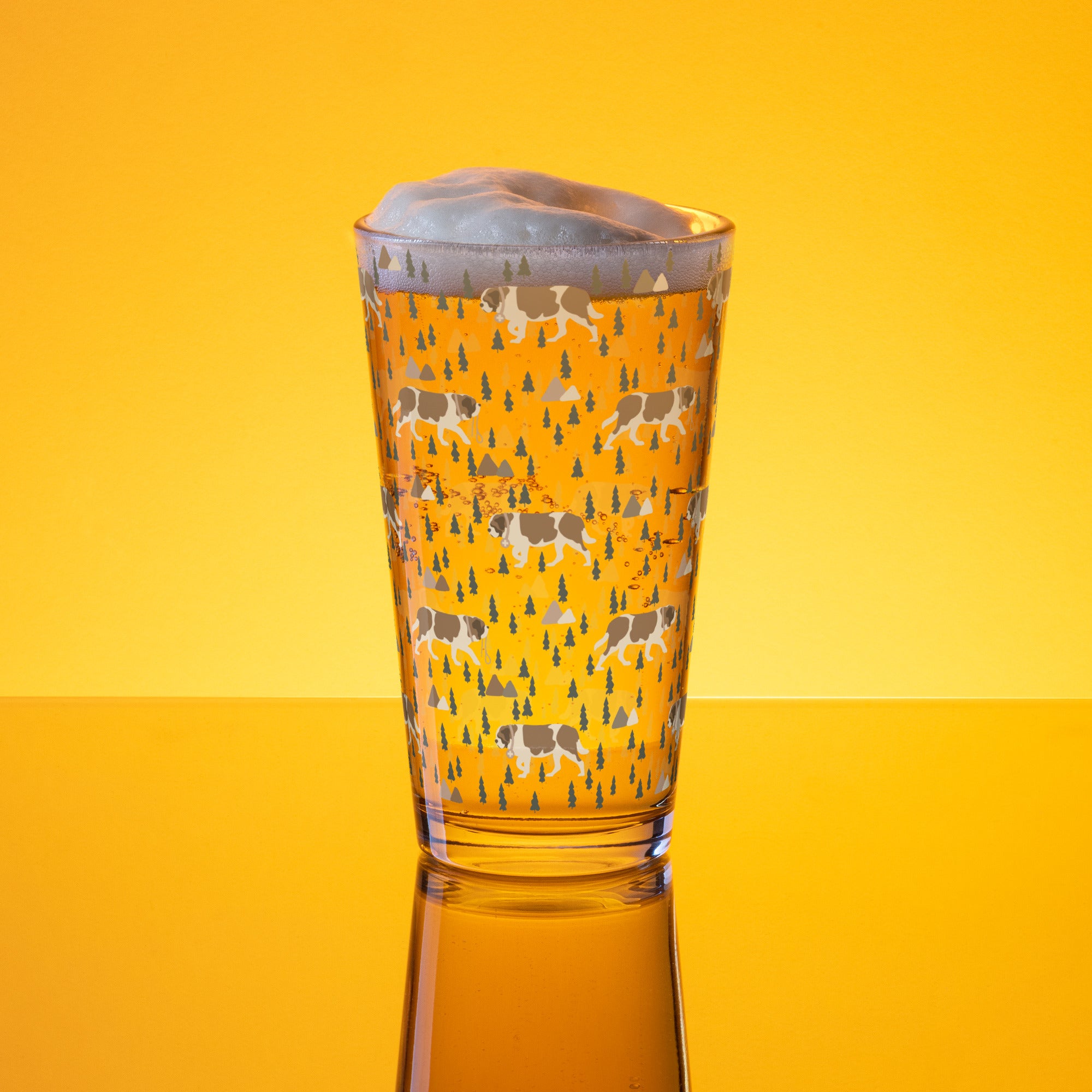 16 oz shaker pint glass with a modern pattern of Saint Bernard dogs, mountains and pine trees by Lucy and Norman