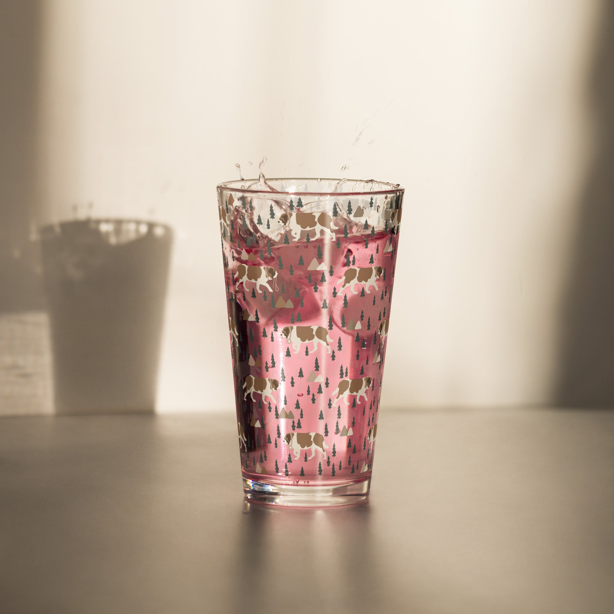 16 oz shaker pint glass with a modern pattern of Saint Bernard dogs, mountains and pine trees by Lucy and Norman