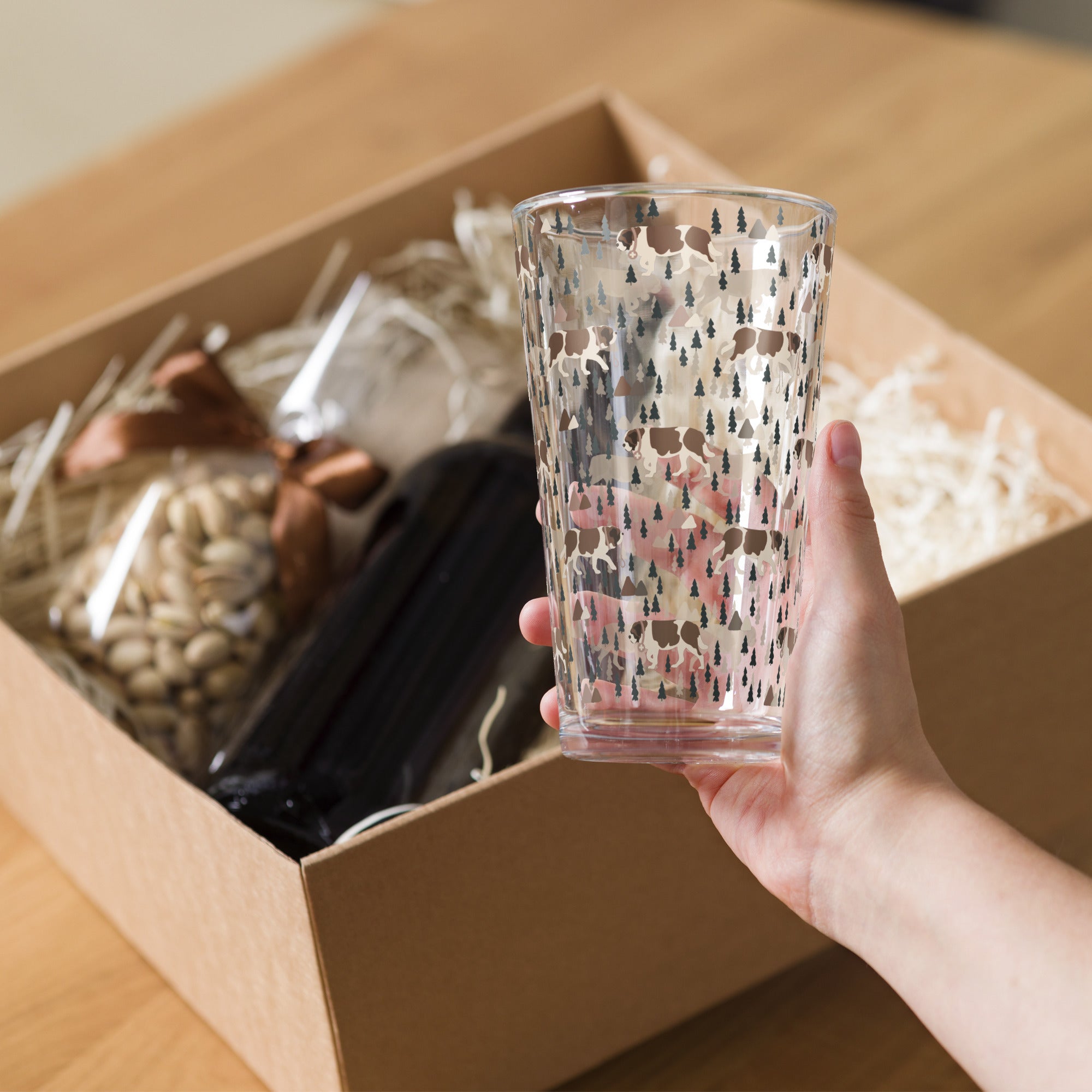 16 oz shaker pint glass with a modern pattern of Saint Bernard dogs, mountains and pine trees by Lucy and Norman