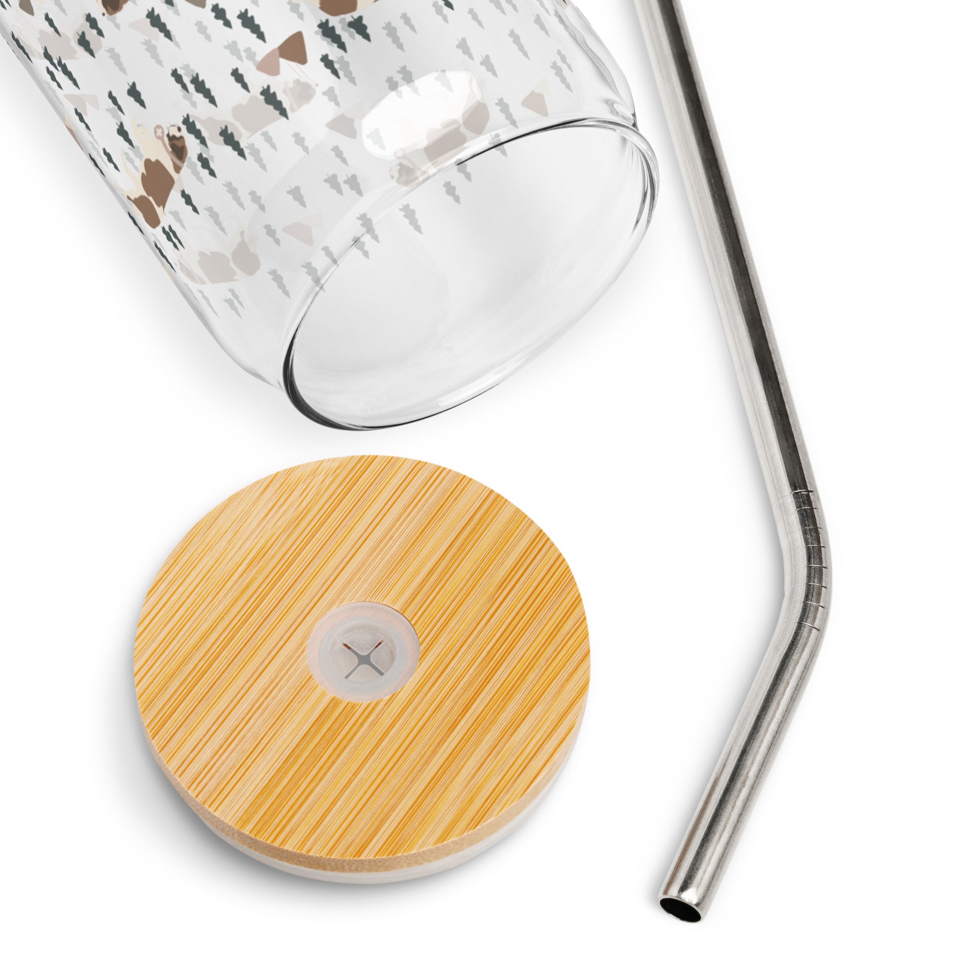 16 oz can-shaped glass tumbler, bamboo wood lid and metal straw. Features a modern pattern of Saint Bernard dogs, mountains and pine trees by Lucy and Norman
