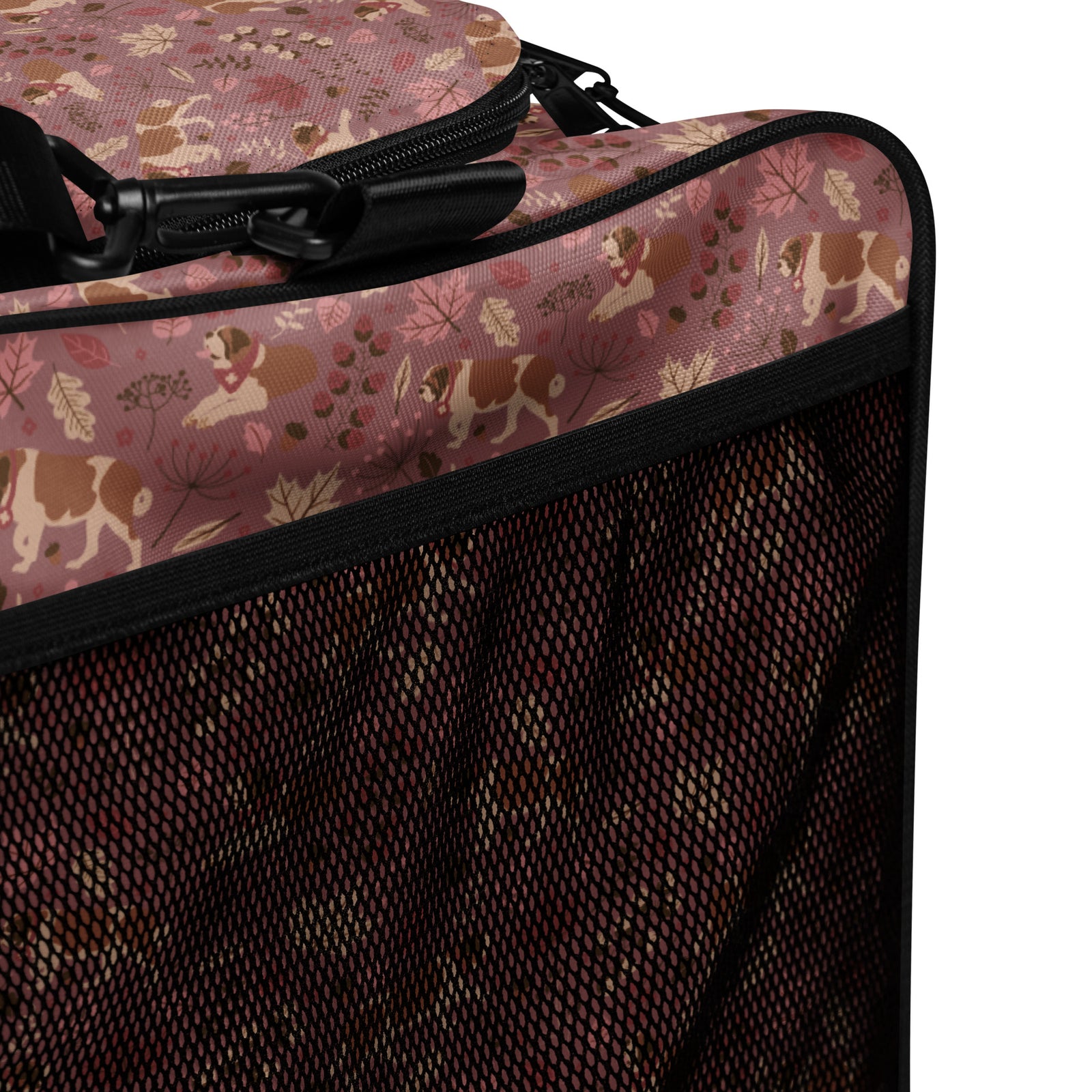 Rosy Fall Saint Bernard floral duffle bag in warm pink, brown, and autumn leaf tones with black padded shoulder strap, handles, zip compartment, and mesh side pocket.
