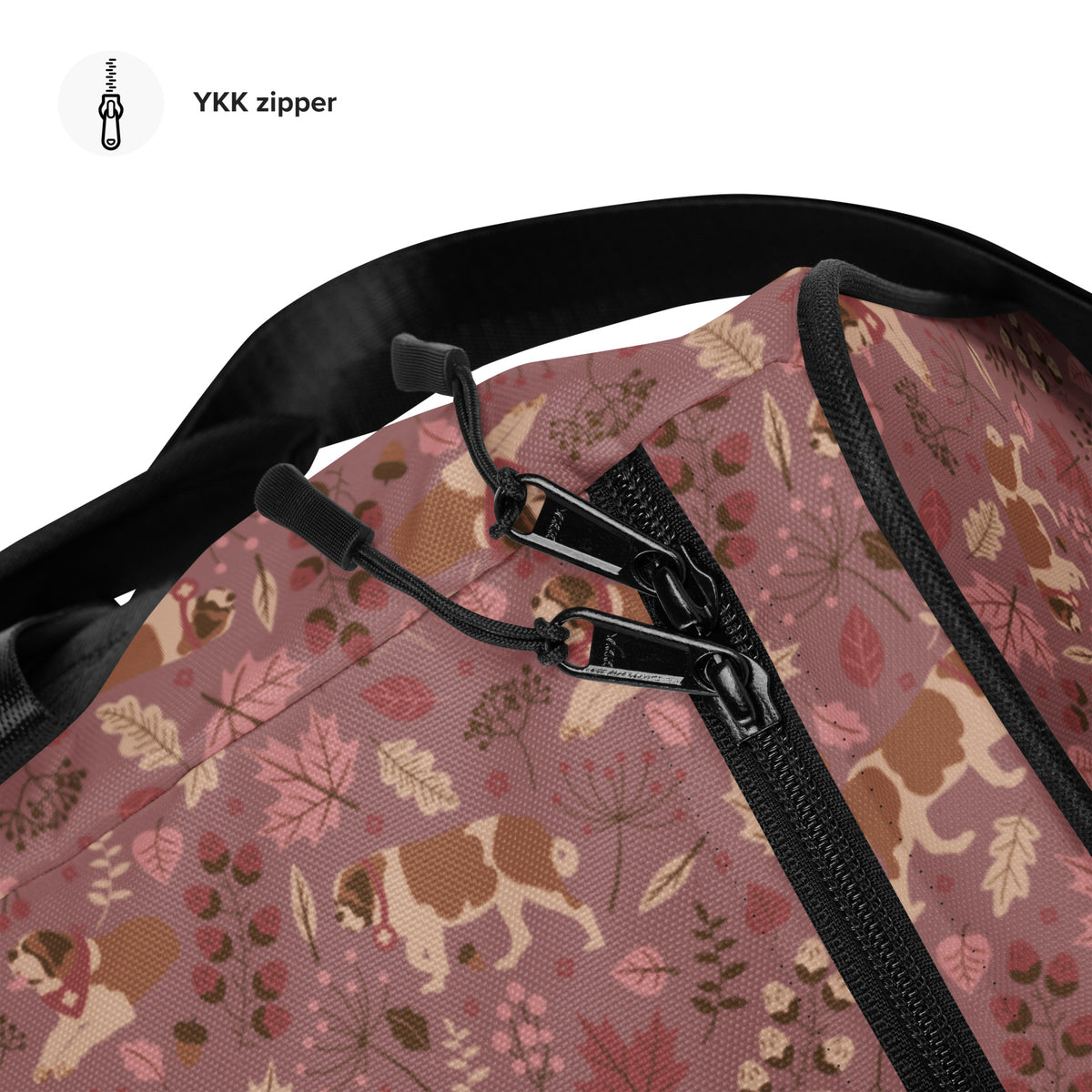 Rosy Fall Saint Bernard floral duffle bag in warm pink, brown, and autumn leaf tones with black padded shoulder strap, handles, zip compartment, and mesh side pocket.