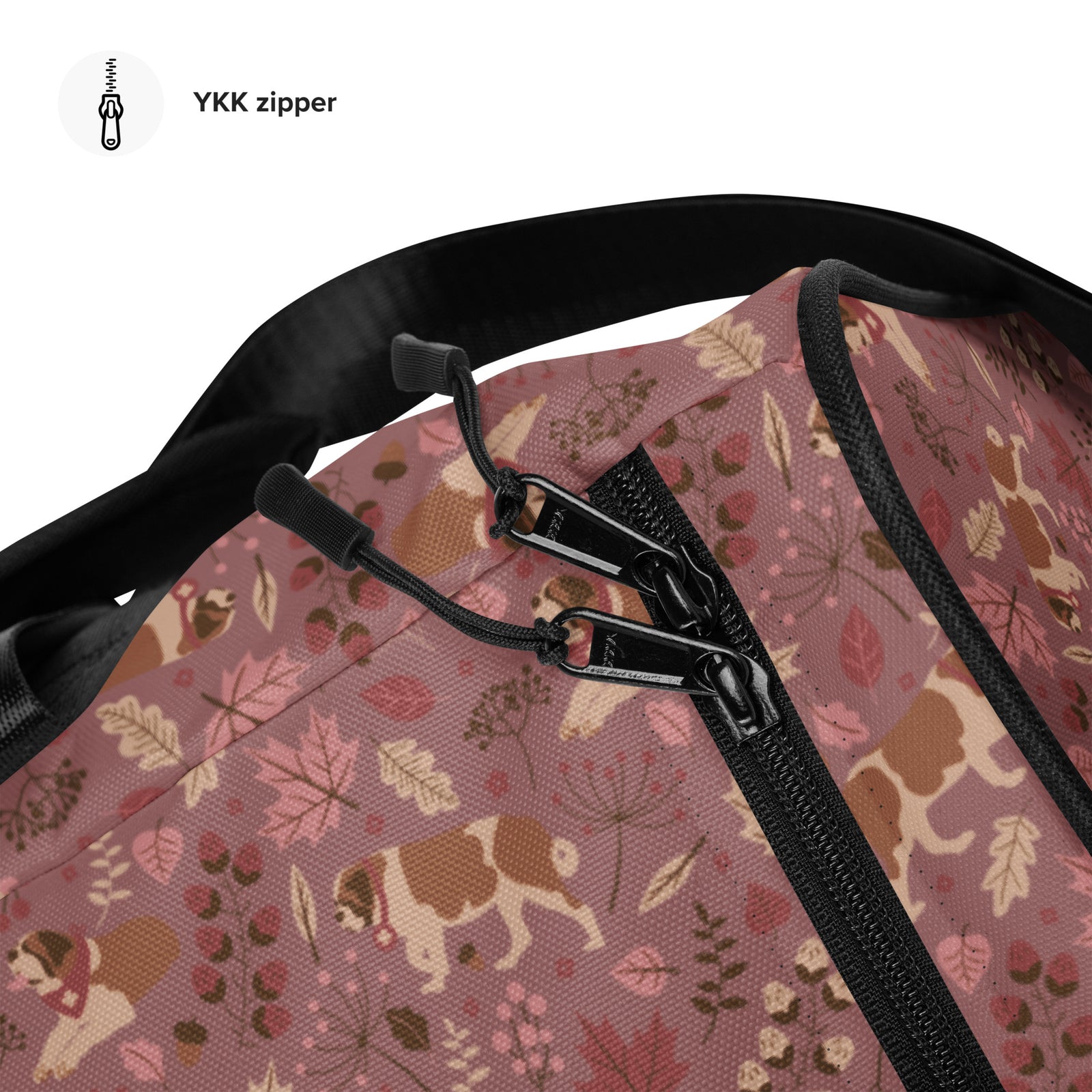 Rosy Fall Saint Bernard floral duffle bag in warm pink, brown, and autumn leaf tones with black padded shoulder strap, handles, zip compartment, and mesh side pocket.