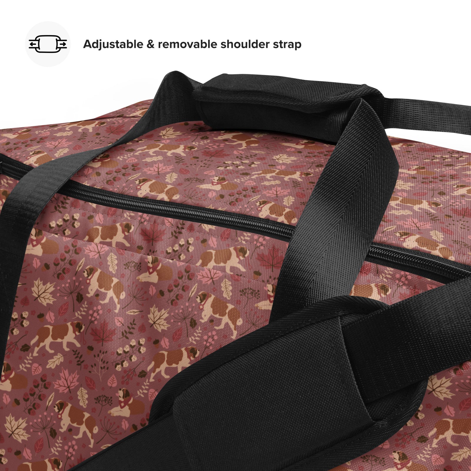 Rosy Fall Saint Bernard floral duffle bag in warm pink, brown, and autumn leaf tones with black padded shoulder strap, handles, zip compartment, and mesh side pocket.