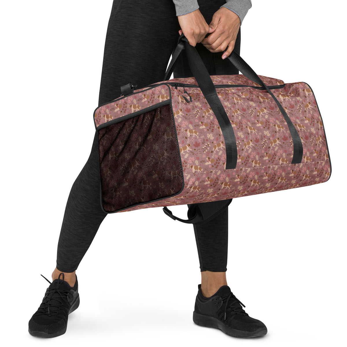 Rosy Fall Saint Bernard floral duffle bag in warm pink, brown, and autumn leaf tones with black padded shoulder strap, handles, zip compartment, and mesh side pocket.