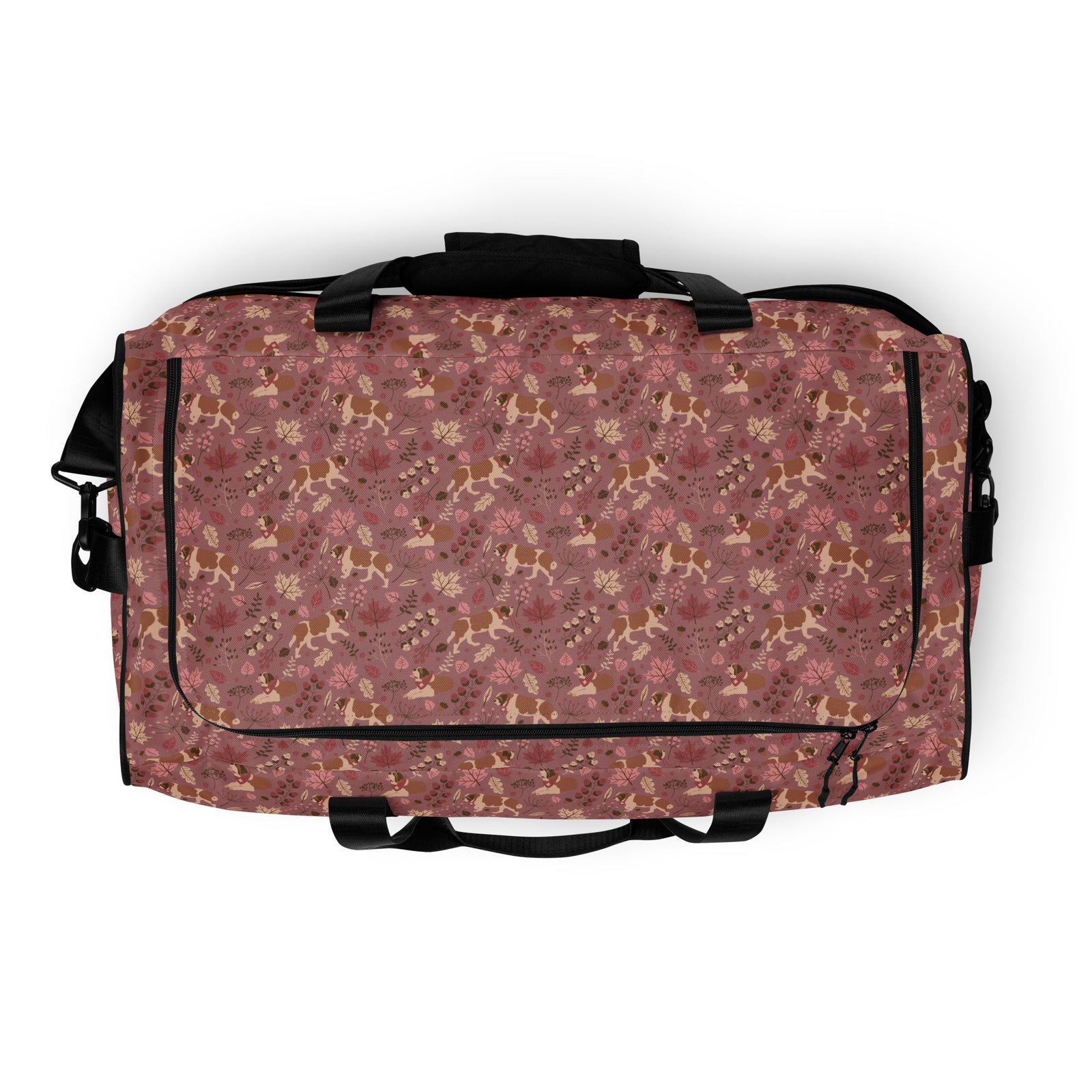 Rosy Fall Saint Bernard floral duffle bag in warm pink, brown, and autumn leaf tones with black padded shoulder strap, handles, zip compartment, and mesh side pocket.