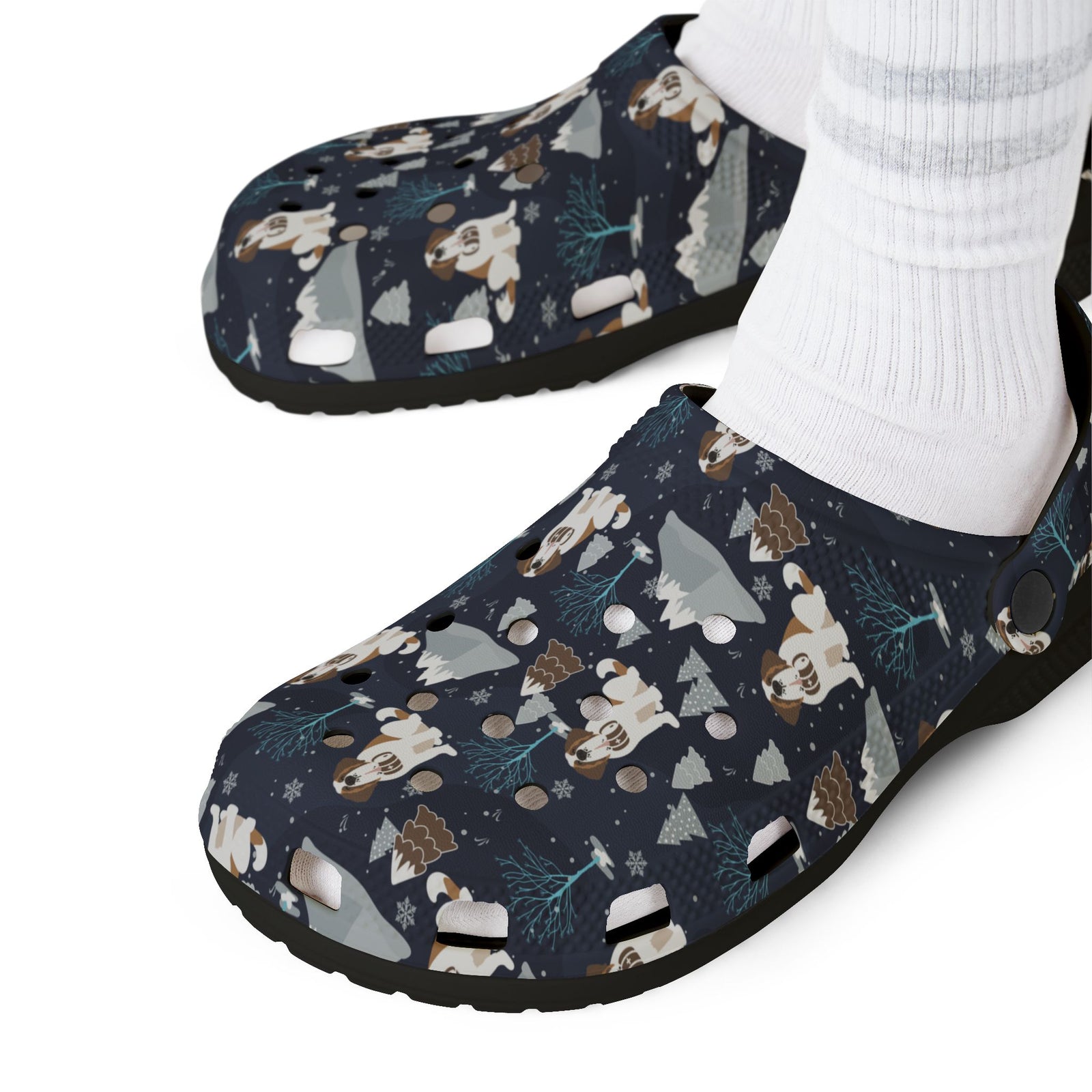 Black EVA clog shoes with a navy all-over alpine chill pattern featuring frosted mountain peaks, blue trees and Saint Bernards by Lucy and Norman
