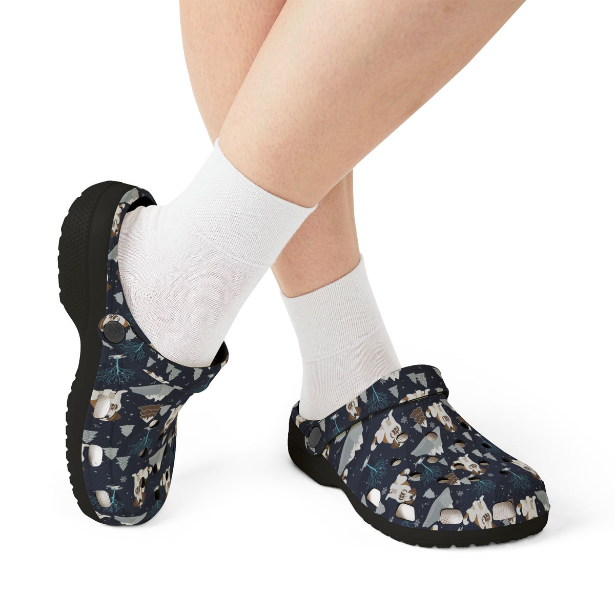 Black EVA clog shoes with a navy all-over alpine chill pattern featuring frosted mountain peaks, blue trees and Saint Bernards by Lucy and Norman